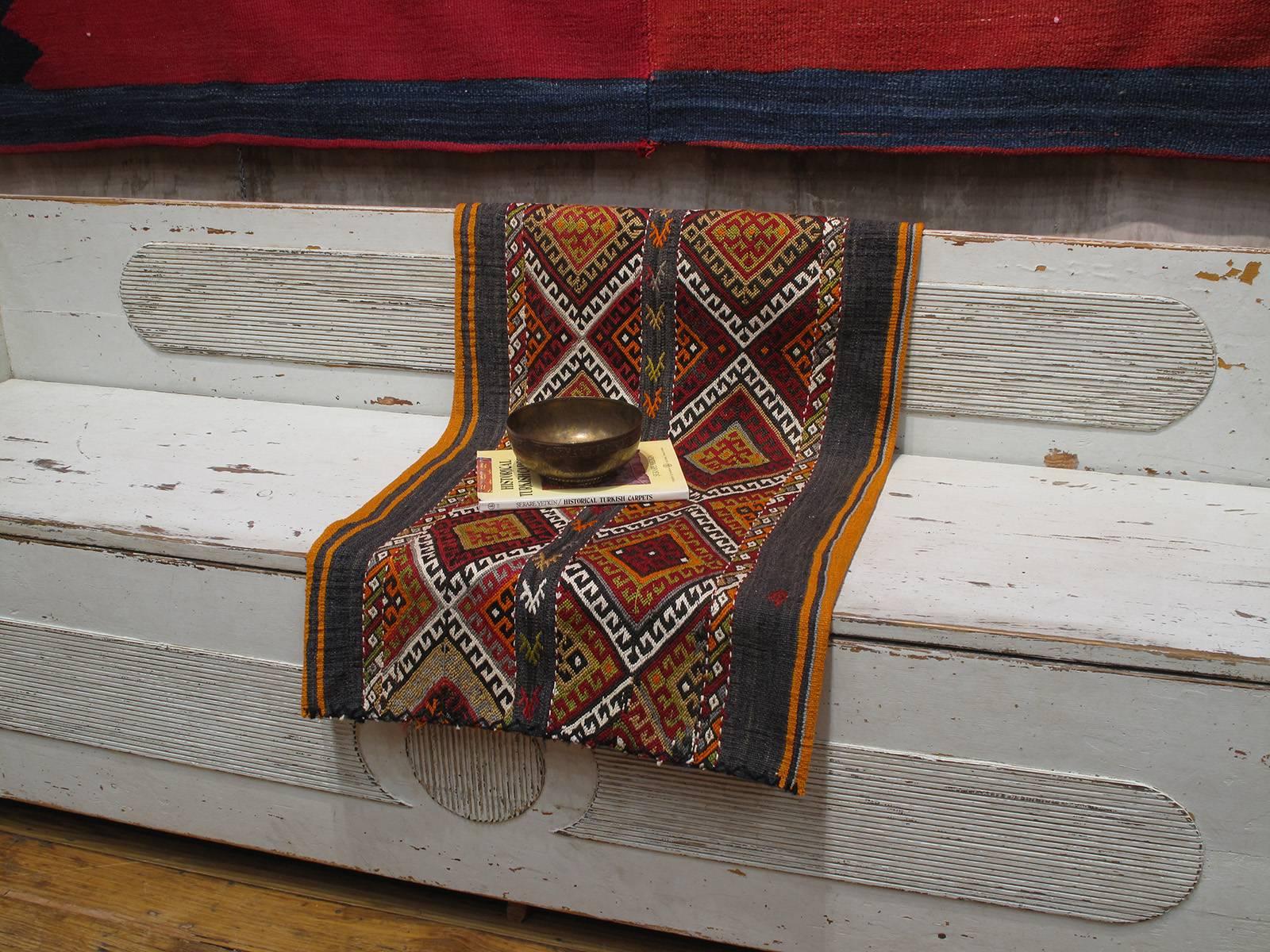 A tribal cargo bag from Southeastern Turkey, flat-woven with an intricate brocaded panel in the front. Woven exclusively for domestic use, with very little change over generations, these sacks were probably the best preservers of centuries-old