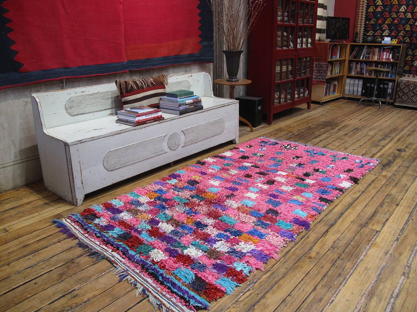 A Moroccan rag rug, woven entirely with cut-up pieces of fabric from old clothes, etc. - boucherouite means rag or torn cloth in Moroccan Arabic. A relatively recent phenomenon, such weavings are products of socio-economic changes in Moroccan