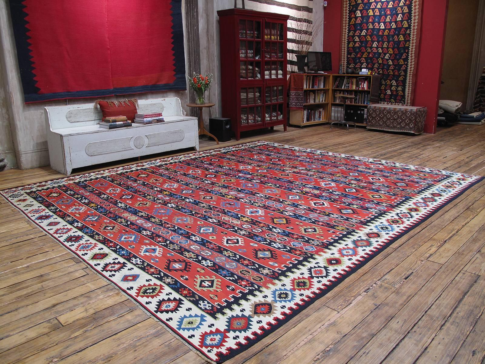 A very handsome old Kilim of large and almost square proportions from the border region between Serbia and Bulgaria, which has a centuries old tradition of Kilim weaving. Older examples from the region are called Sharkoy, the old Turkish name of the