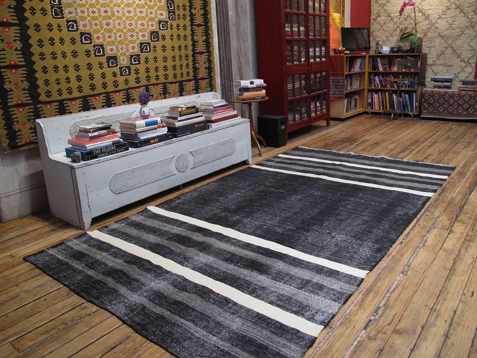 A large, Primitive, dramatic tribal flat-weave woven entirely with goat hair in natural dark brown (almost black), gray and ivory bands. Woven as a utilitarian floor cover, it has a rough texture. A simple, authentic weaving with great Modern or