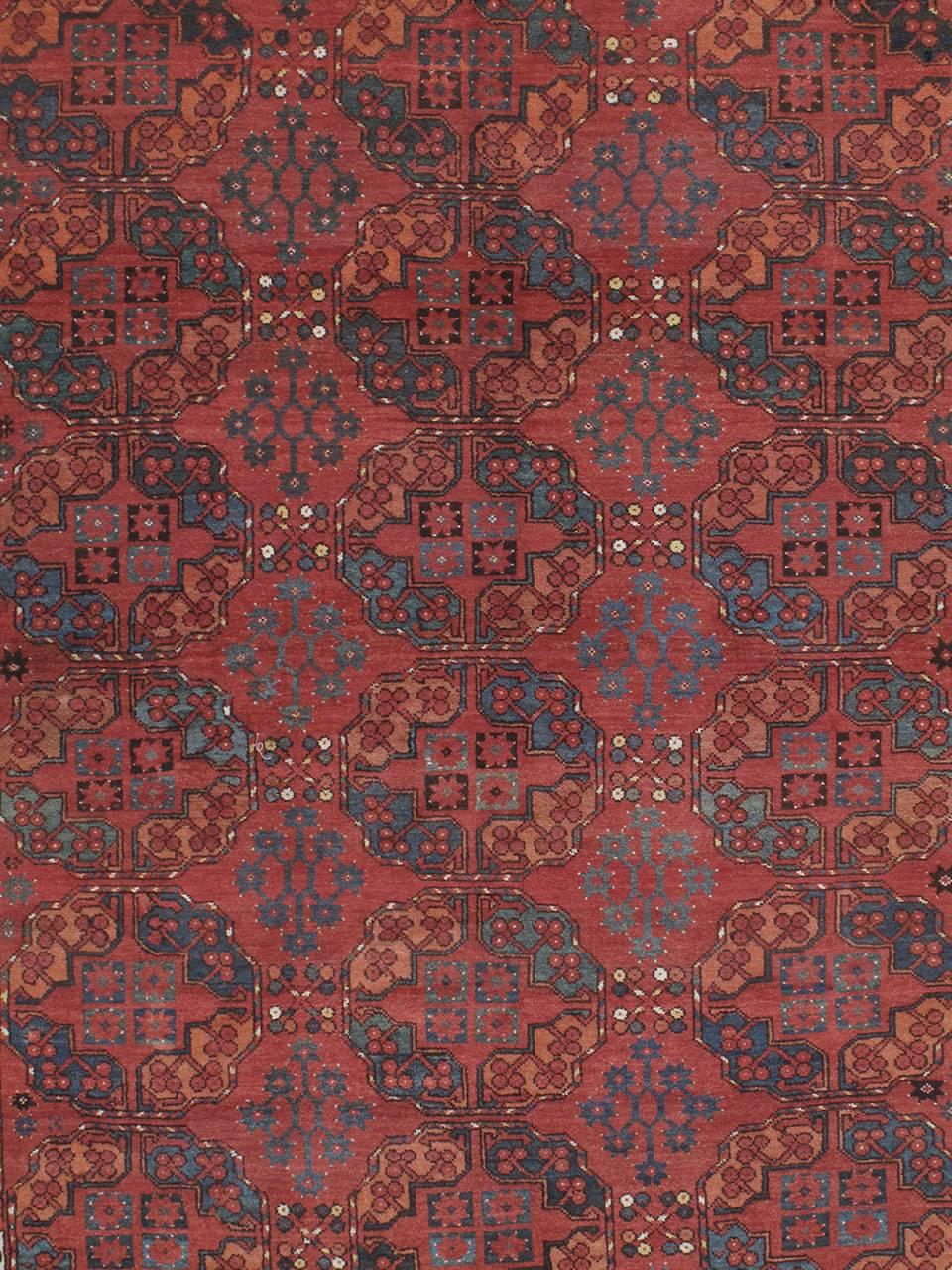 Antique Ersari Main carpet or rug. An antique tribal carpet from Central Asia attributed to the Ersari Turkmen. Deeply saturated colors, dominated by rich madder reds, repetitive heraldic symbols, called 