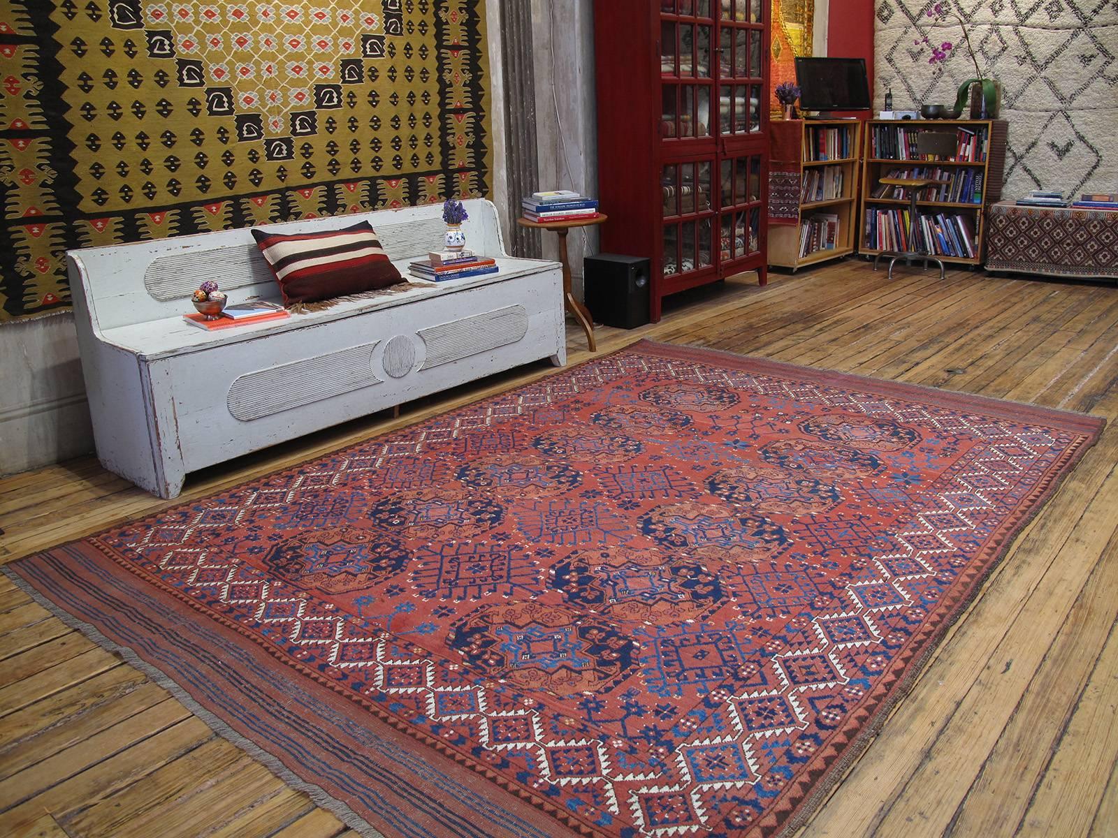Antique Turkmen Main carpet or rug. An antique tribal carpet from Central Asia attributed to the Ersari Turkmen. Deeply saturated colors, dominated by rich madder reds, repetitive heraldic symbols, called 