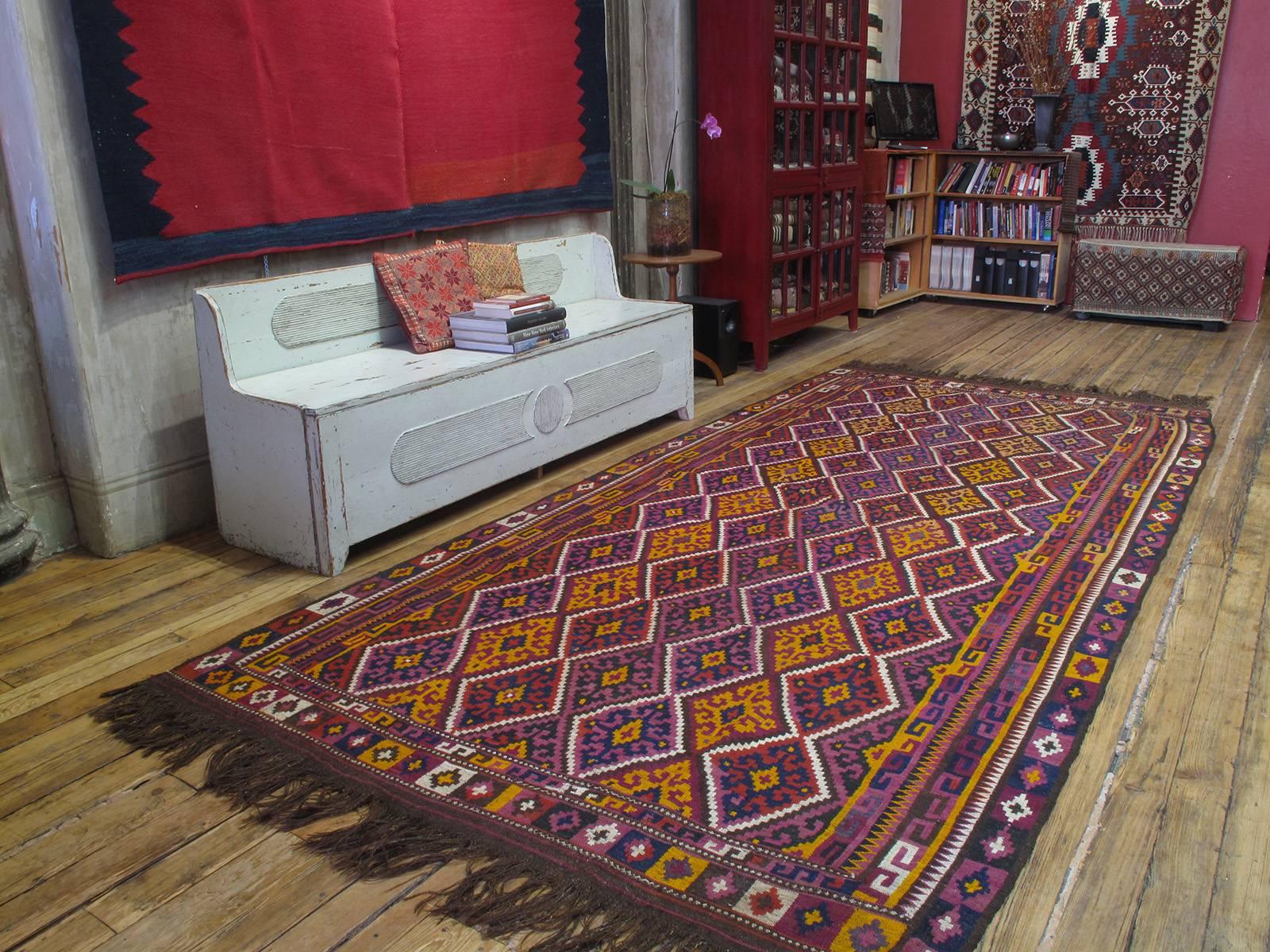Uzbek Kilim rug. A striking tribal flat-weave rug from NW Afghanistan with crisp drawing and vibrant colors.