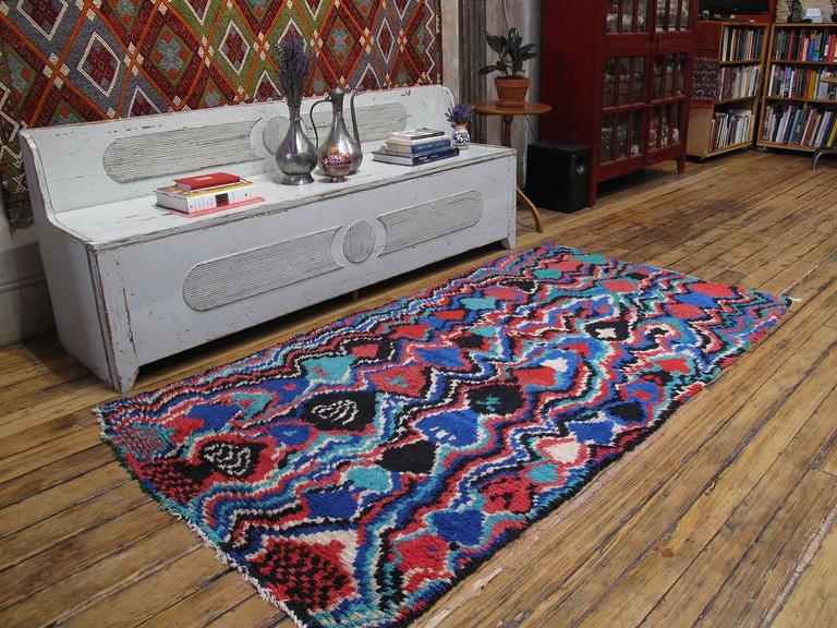 Psychedelic Azilal Berber Moroccan rug. The classic Berber diamond grid melted into a psychedelic vision at the hands of a very talented weaver. One of our best finds this year. The rugs of the high Atlas mountains of Morocco have remained a