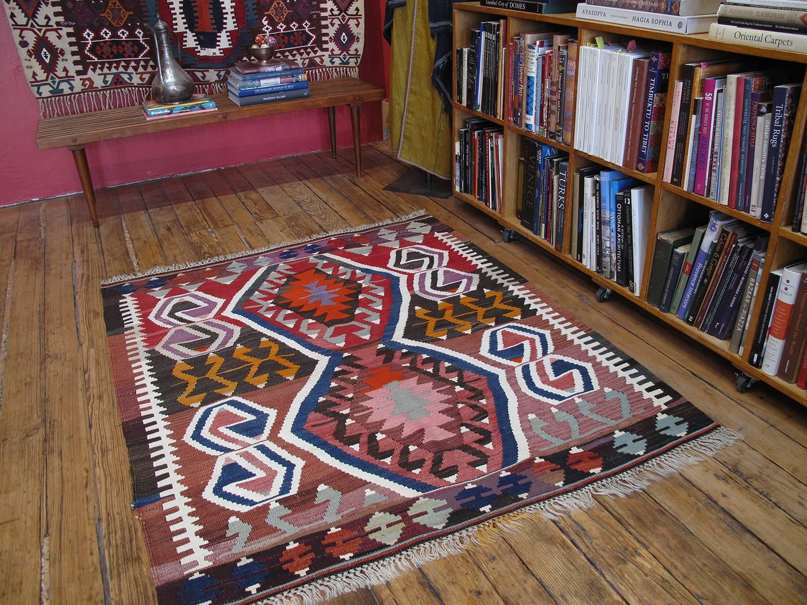 A striking Kilim from Central Turkey in an unusual small format, featuring an iconic design from this region that is often seen in much longer kilims. Powerful rendition, using bright cotton highlights for maximum impact. Though it is not an