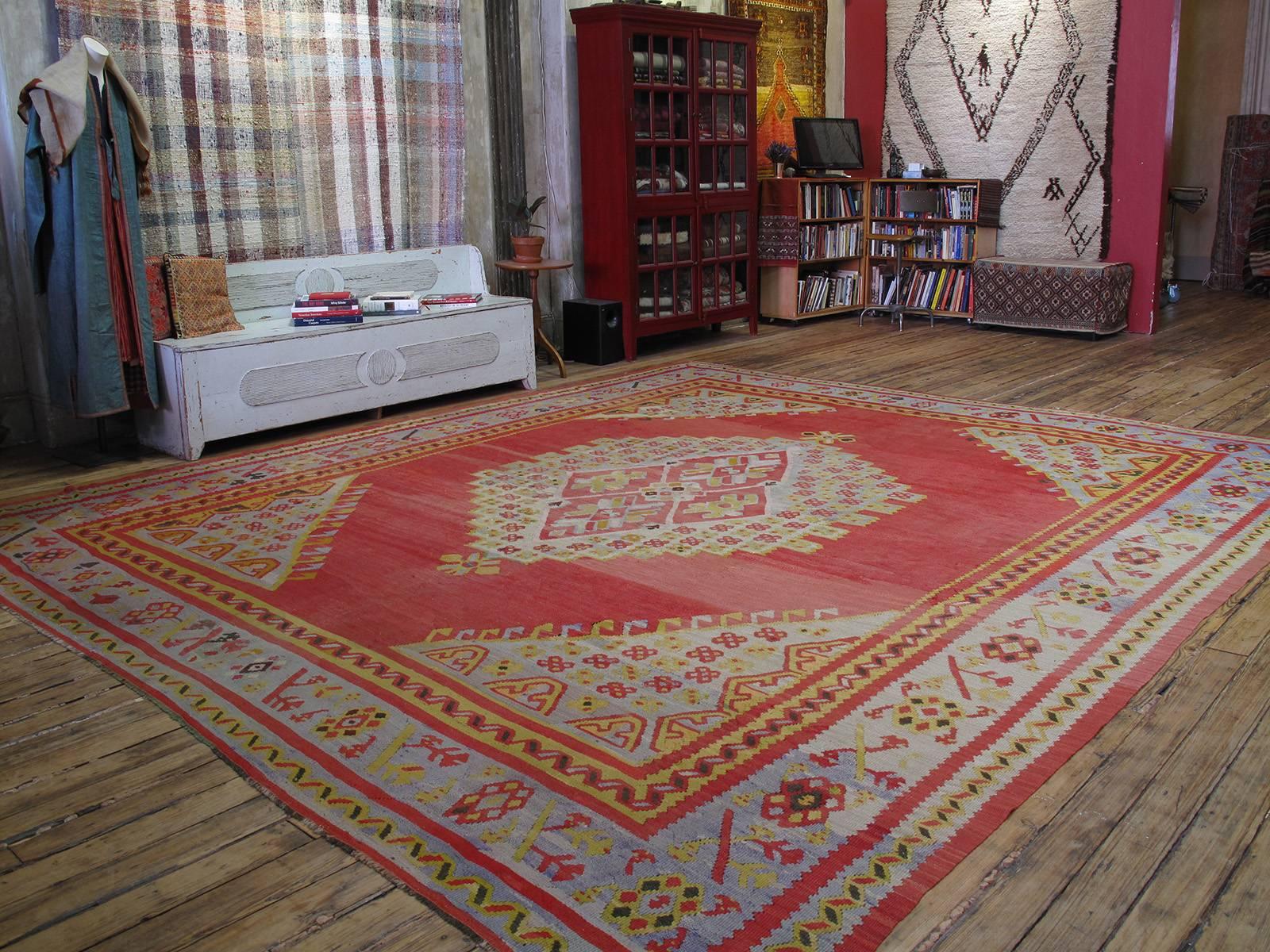 Large Antique Oushak Kilim rug. A large format antique Kilim rug, woven in the Oushak region of Western Turkey. Such kilims were contemporary with the many antique Oushak carpets woven at end of the 19th century to meet the increasing demand in the