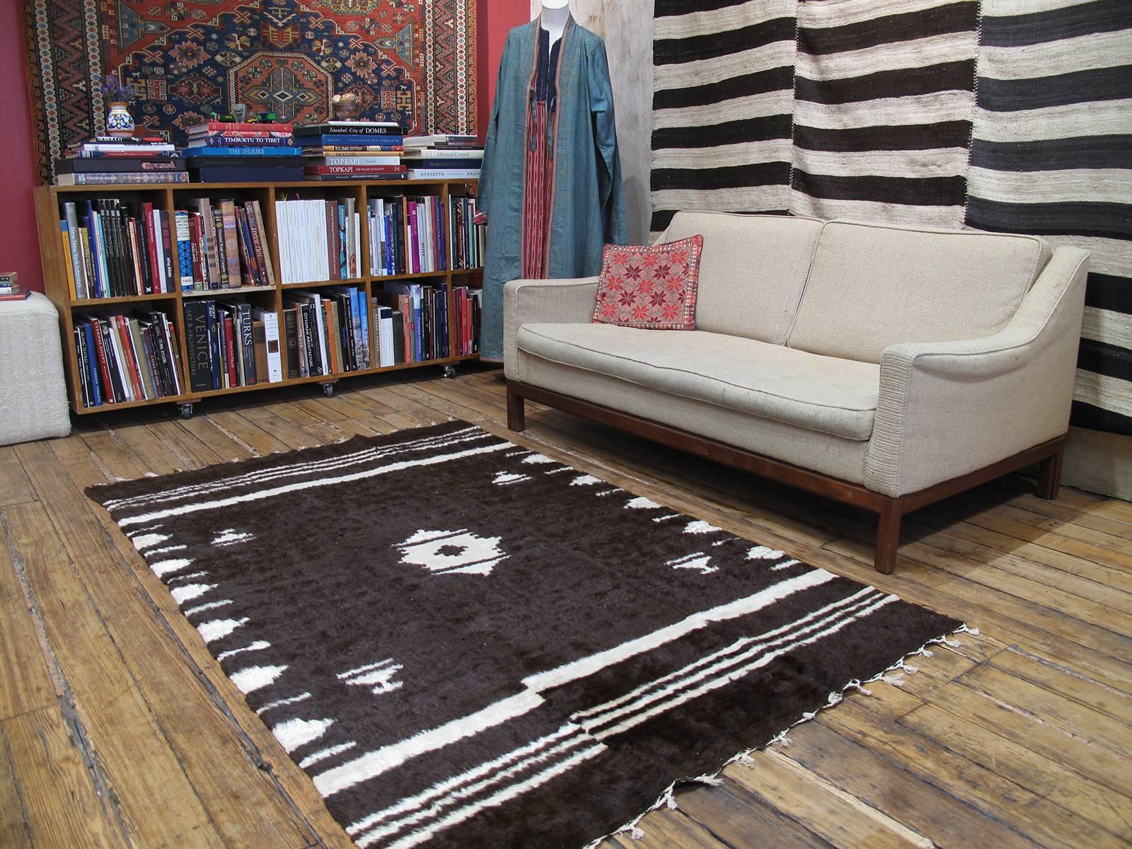Angora blanket rug. An old blanket from Eastern Turkey, woven with the fine, soft hair of the indigenous angora goat, better known as mohair. An older example, woven in three narrow panels. Can be used as a rug on the floor in low traffic, but