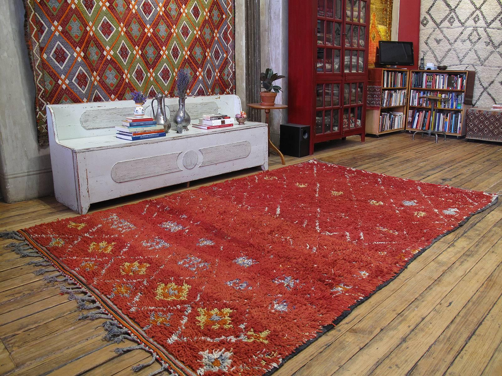 A very nice tribal carpet from the Middle Atlas Mountains, with warm colors, displaying the characteristic Moroccan Berber aesthetic.