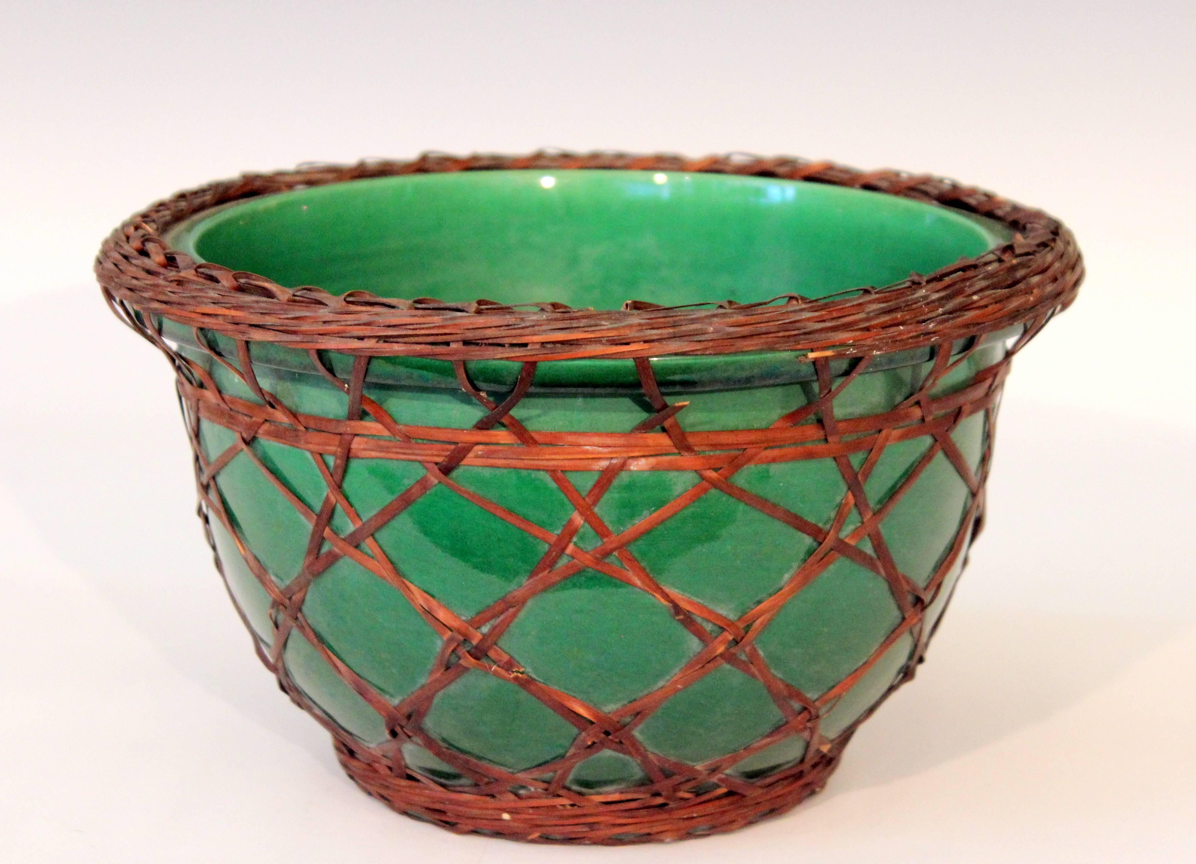 Big Awaji bowl in green monochrome glaze with split bamboo weaving, circa 1910. 6 1/2