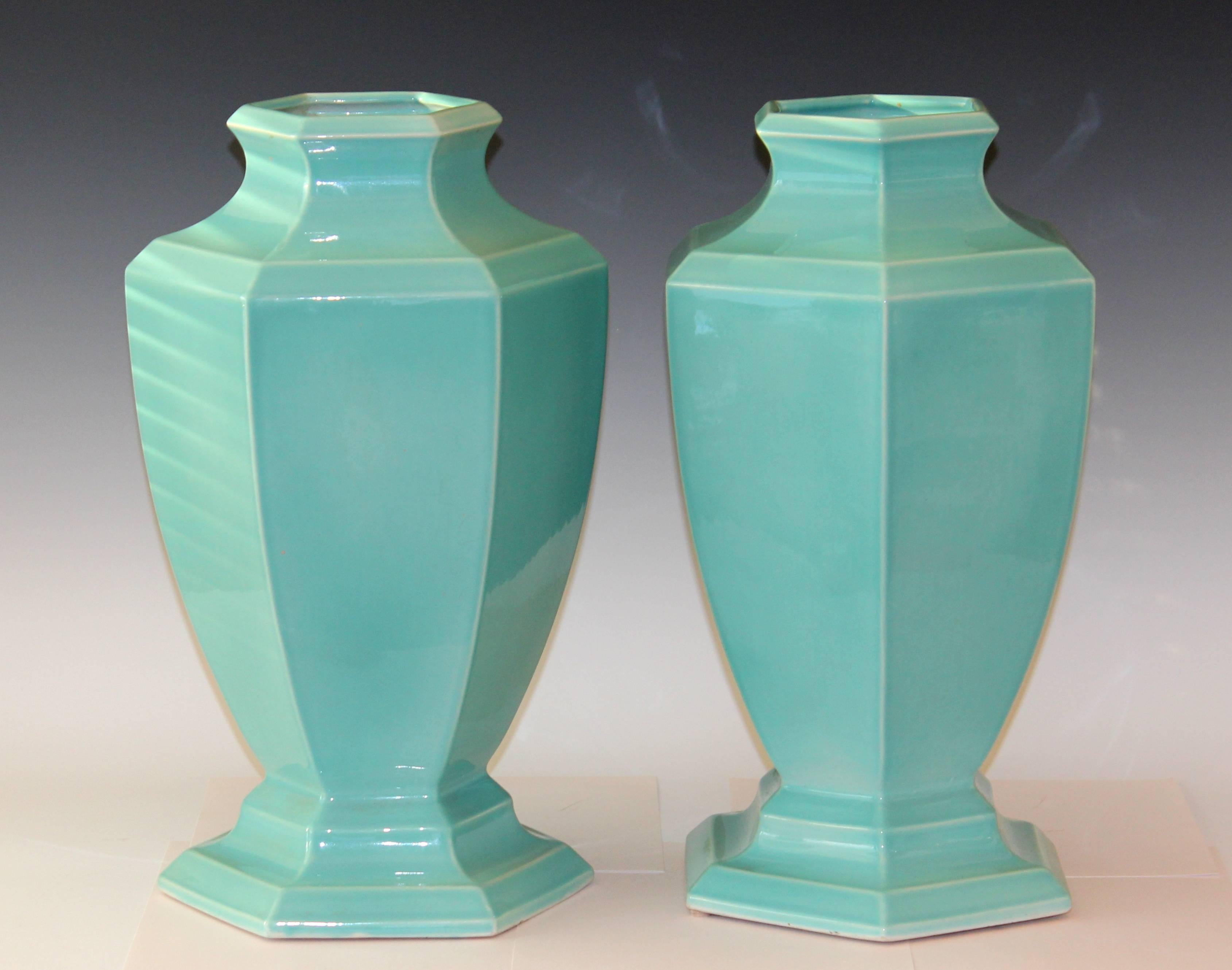 Large pair of Art Deco period hexagonal urns from the Trenton Potteries Company in great aqua turquoise glaze, circa 1930s. Marked on bases. Measures: 18