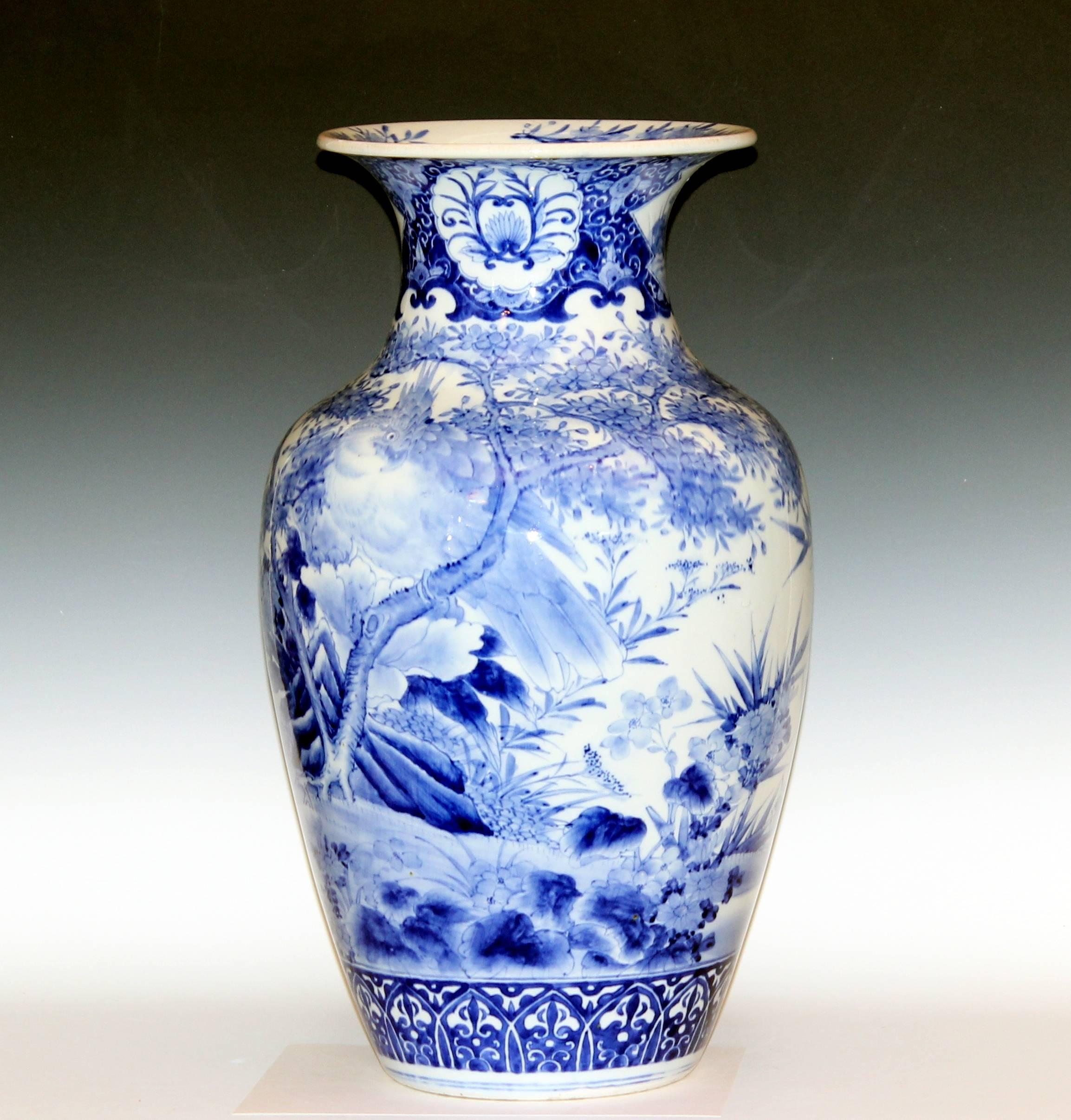 Antique Arita porcelain vase with birds amongst dense foliage and good underglaze cobalt blue color. Late 19th century. 22