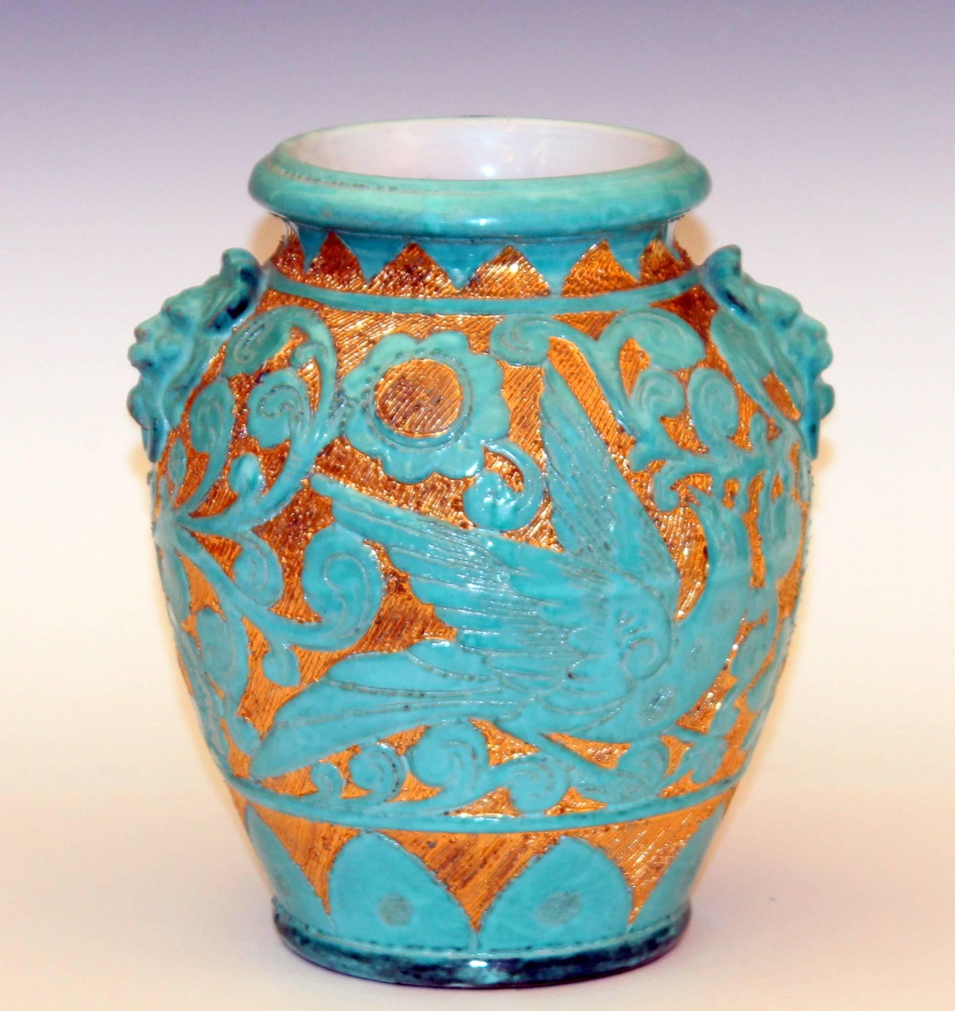 Striking hand turned and carved Italian art pottery vase decorated with turquoise deco style song birds in relief against a fiery golden ground, circa  1950's. Attributed to Fratelli Fanciullacci.  9