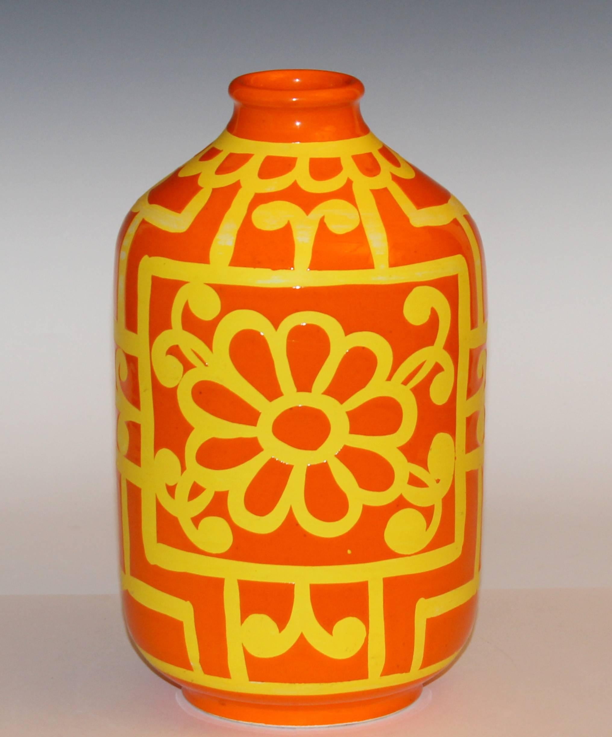 Vintage hand turned Bellini Italian art pottery vase in great atomic orange glaze on a bright yellow wax resist ground, circa 1970's.  11 1/2