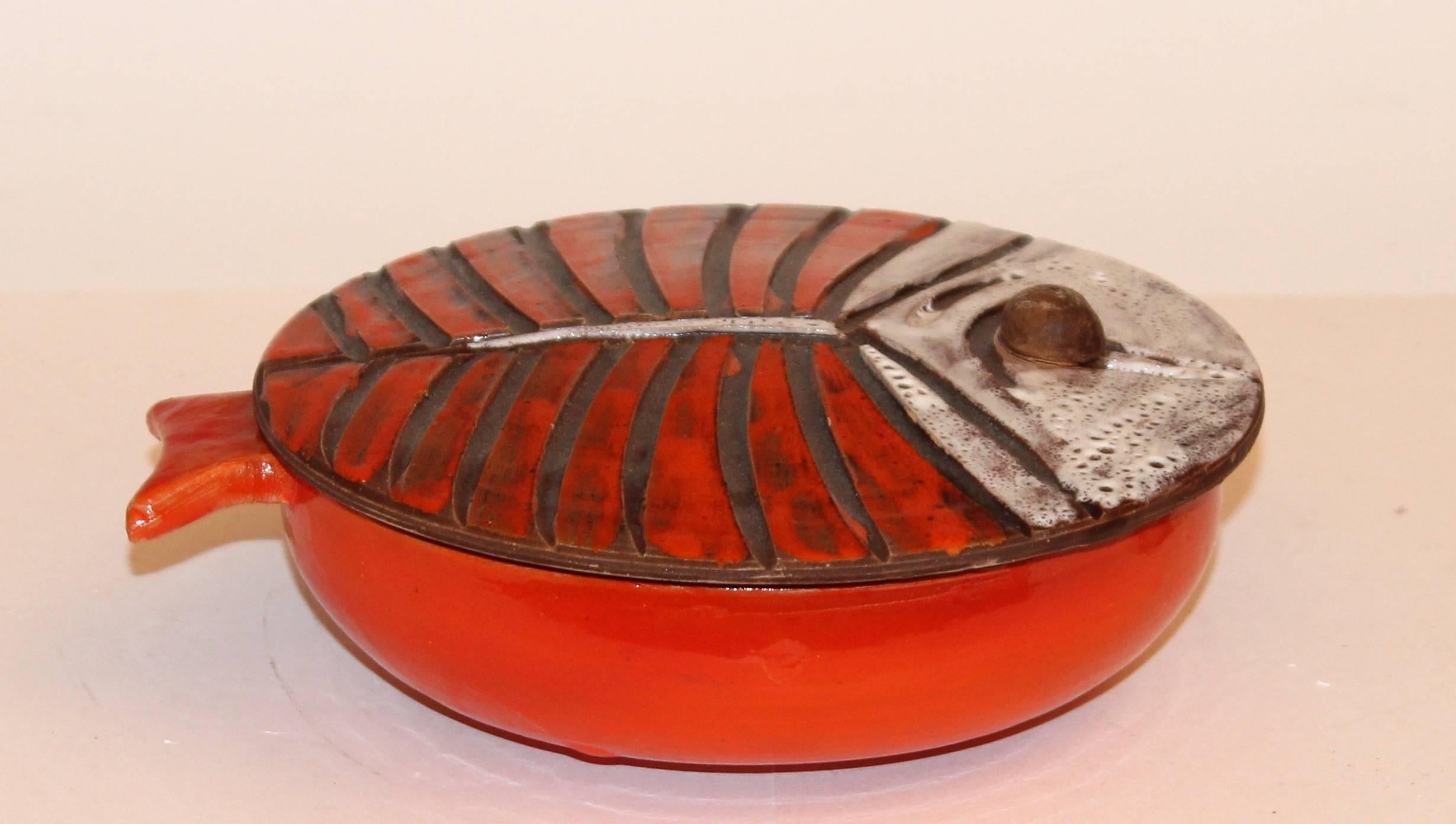 Great, vintage, hand made Vallauris pottery covered dish in the form of a spiny flat fish, circa 1960. Expressively decorated with single large eye knop, deeply carved 