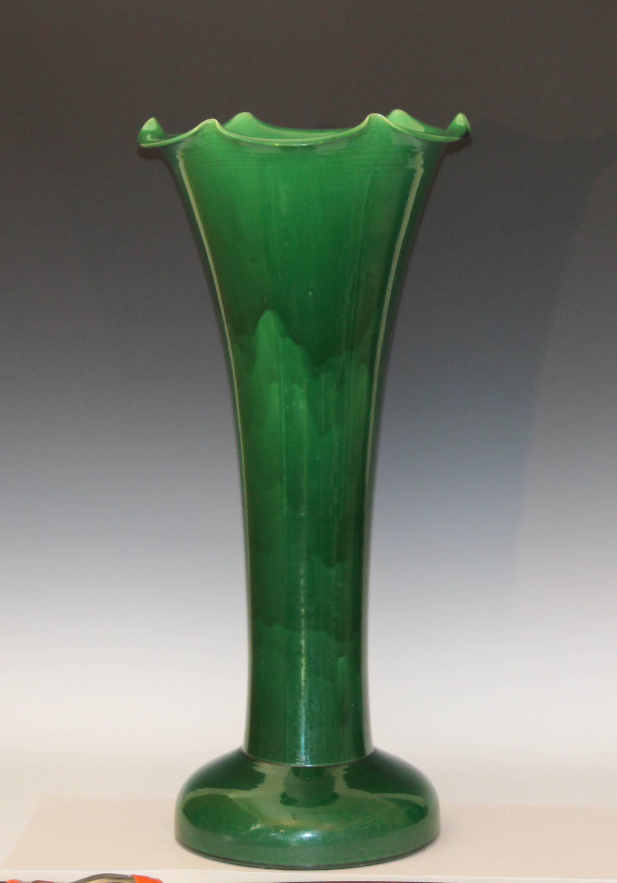 Large Awaji vase in trumpet form with wavy rim and dark green glaze, circa 1910. 30