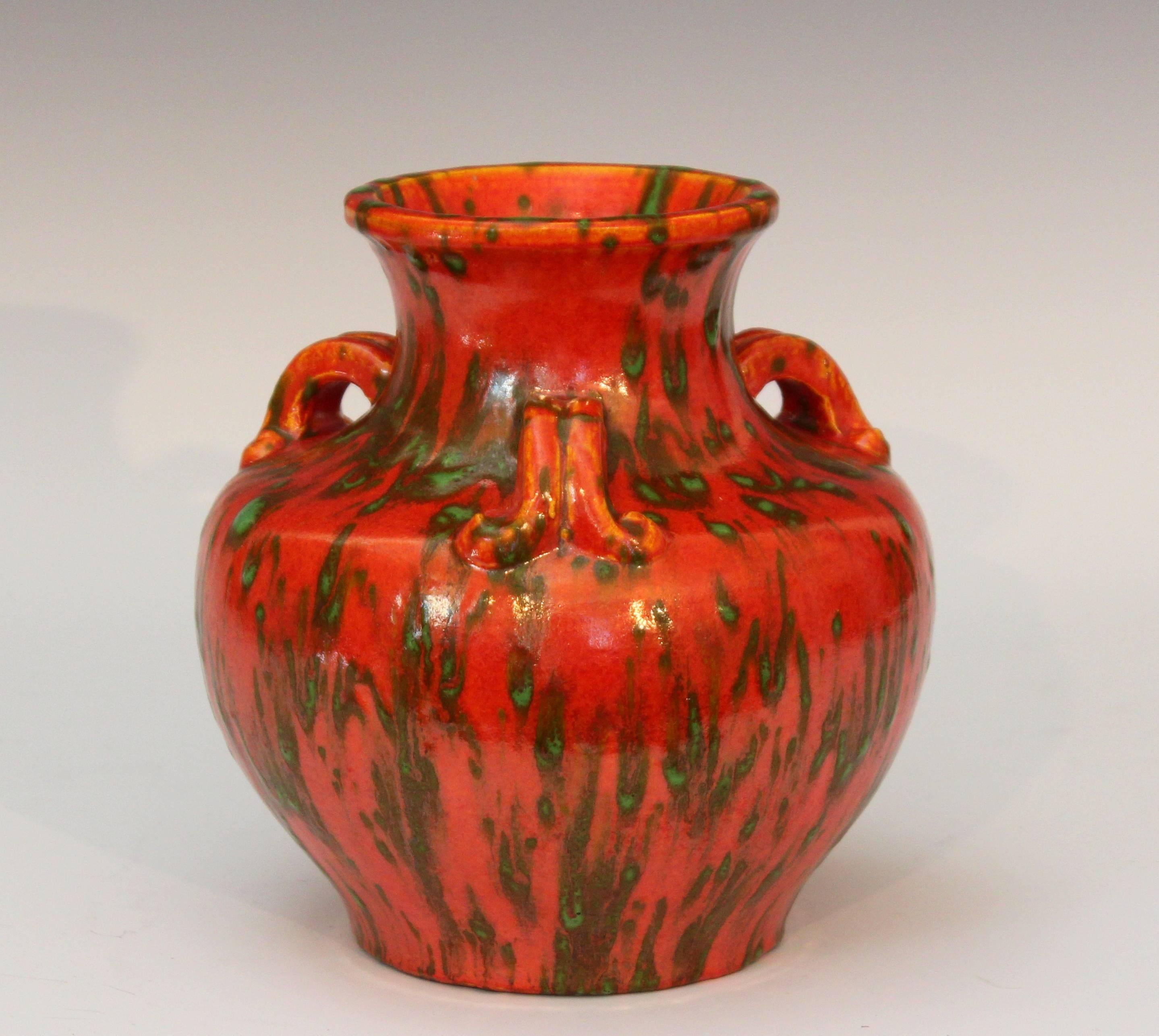 Art Deco Awaji vase in interesting form with three handles sprouting off the shoulder and a terrific chrome orange glaze, circa 1930. 7 1/2