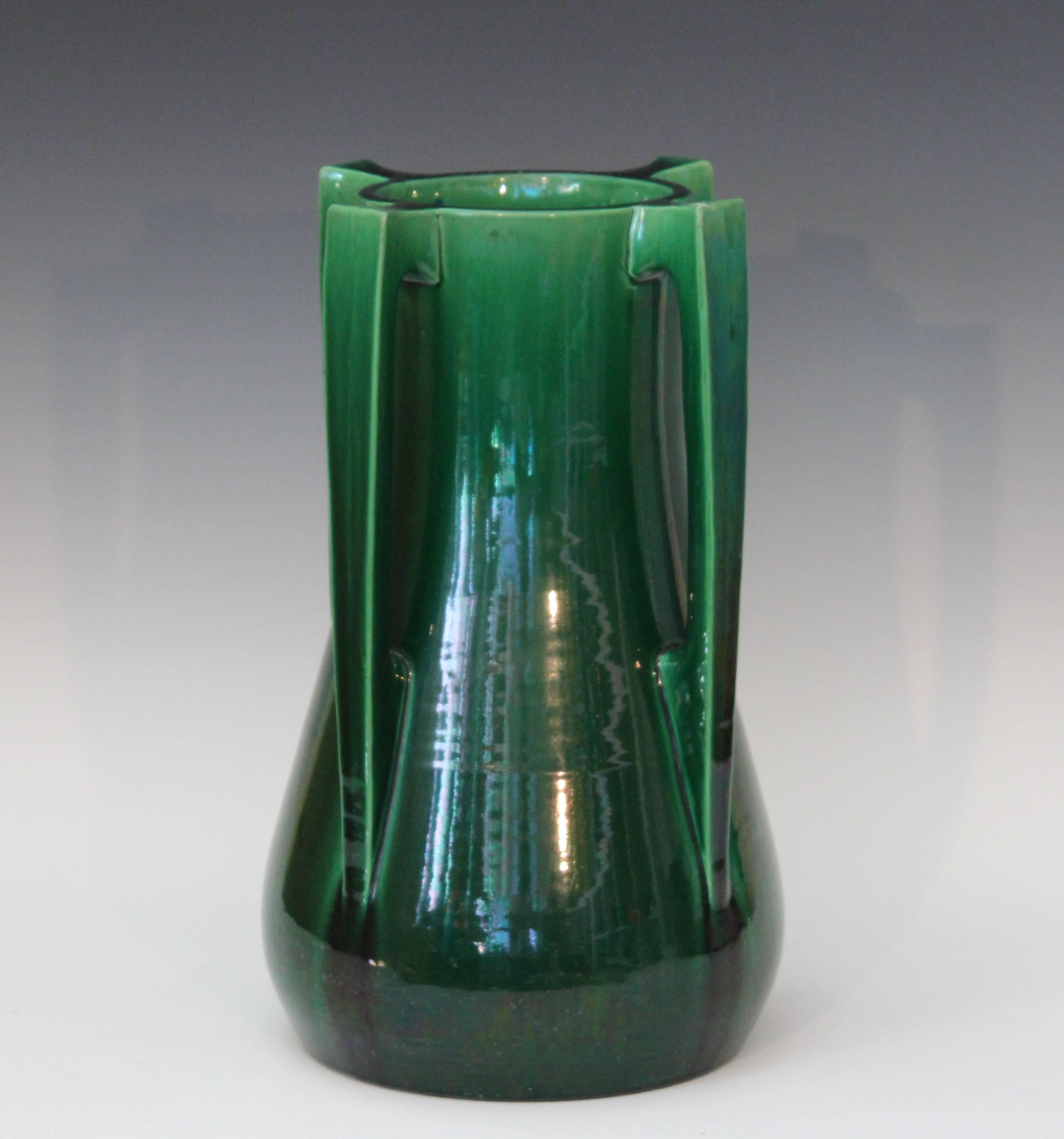 Sleek Awaji vase in terrific architectural form with four applied buttress handles and deep green monochrome glaze, circa 1920s. Measures: 15 1/2