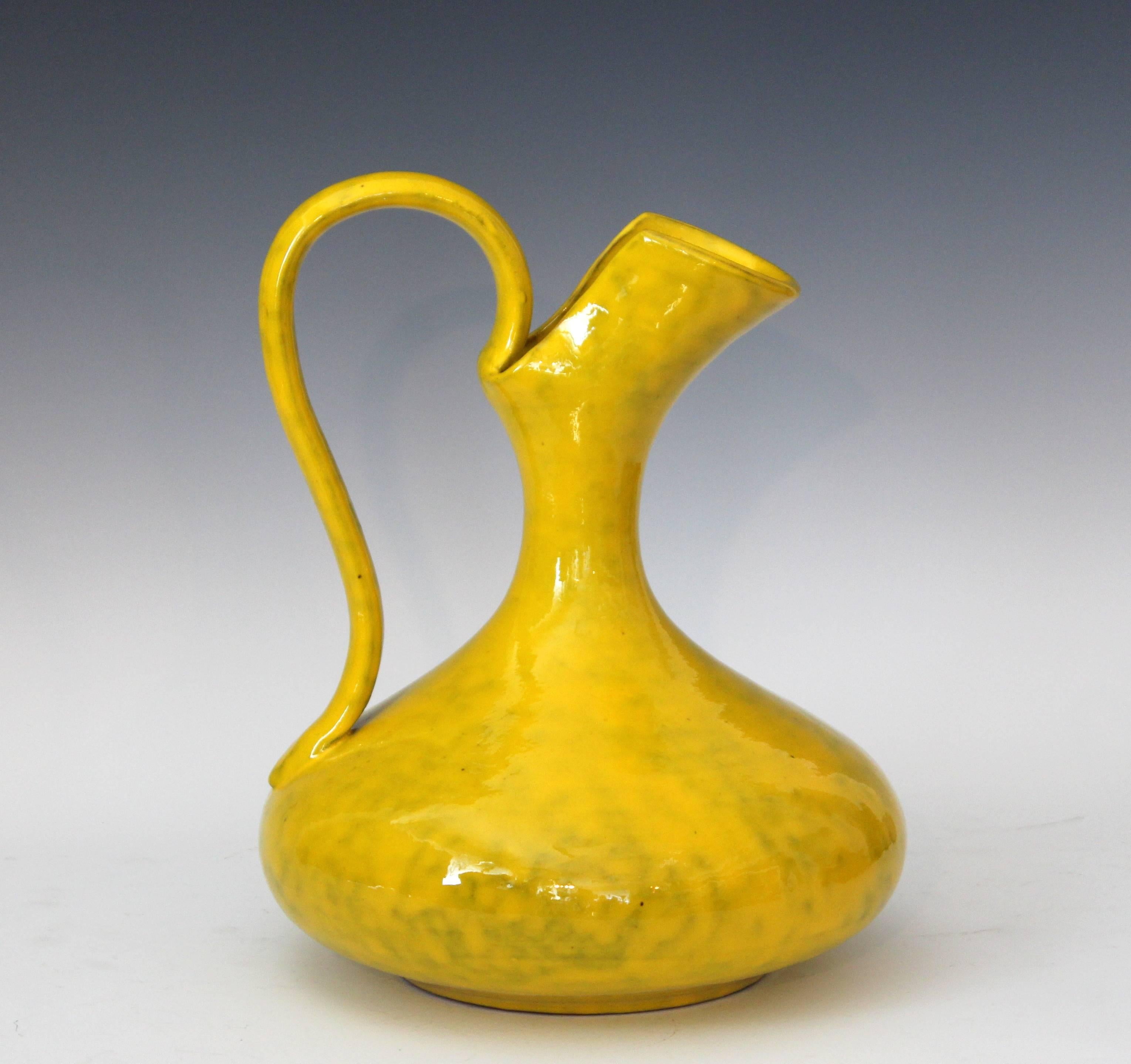 1960s hand-turned Italian pottery pitcher vase in classical form with electric mottled yellow glaze for Rosenthal-Netter. Attributed to Italica Ars. With original Rosenthal-Netter label. Measures: 13