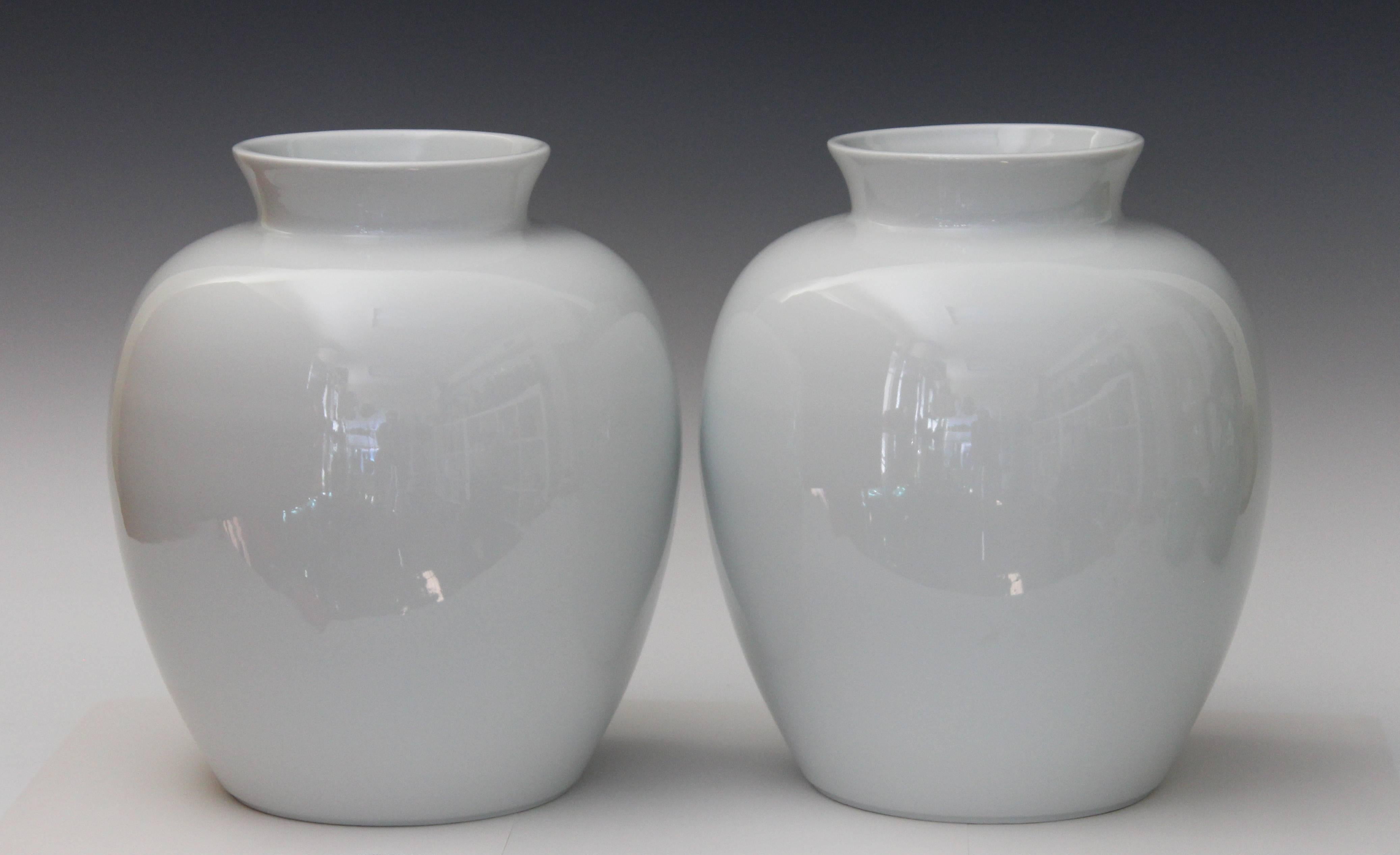 Large pair of Limoges white porcelain Art Deco ginger jar vases, circa 1920s. Measures: 11 5/8" high, 9" diameter. Excellent condition.