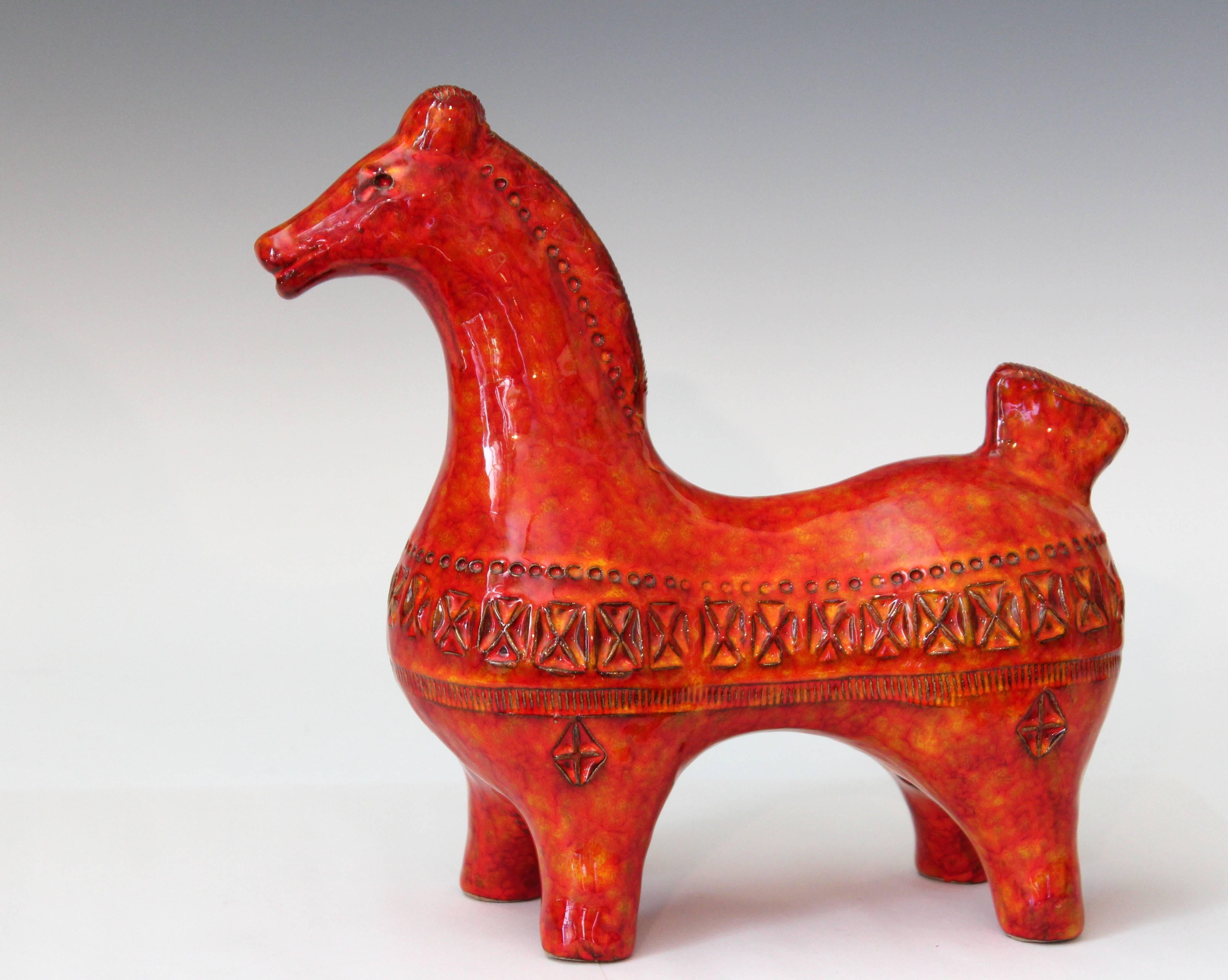 Great Bitossi horse standing gracefully taught with energy, ready for anything. Crisply impressed Rimini decor and finished with electrifying atomic orange red mottled glaze, circa 1960s. Measures: 9 3/4