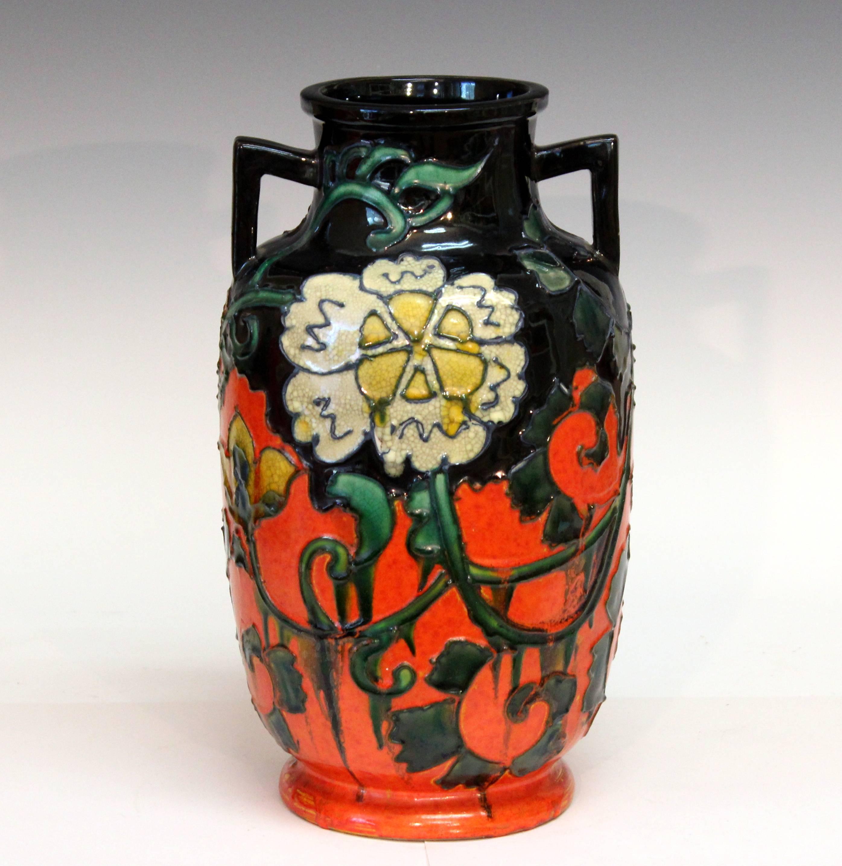 Large and unusual Awaji vase with slip trailed design of meandering flowers against a mirror black and chrome orange ground, circa 1930. Impressed marks. 12 1/8