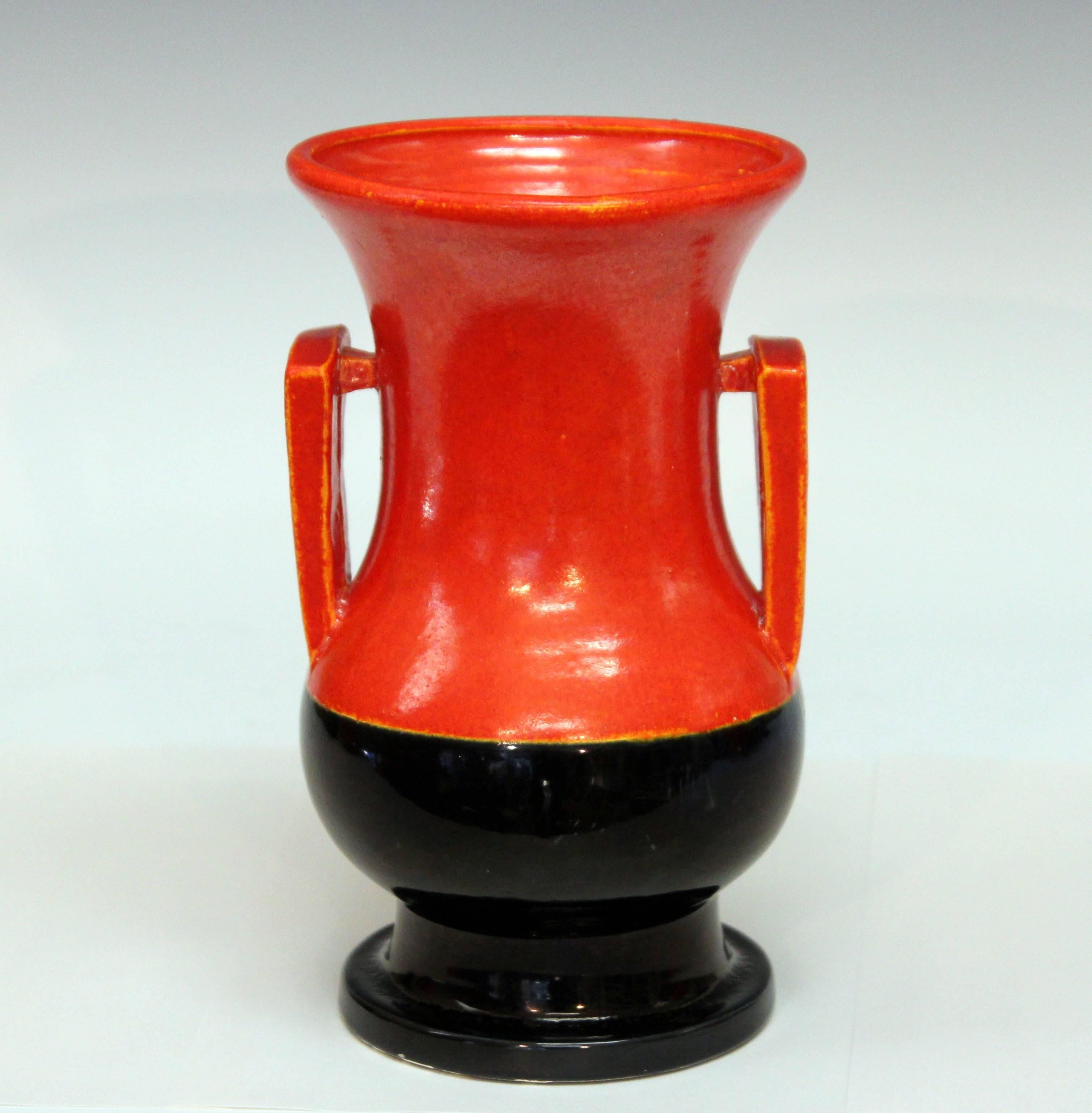 Awaji pottery studio vase in interesting Art Deco form with rectangular buttress handles and striking orange and black glazes, circa 1930. Measures: 8 1/2