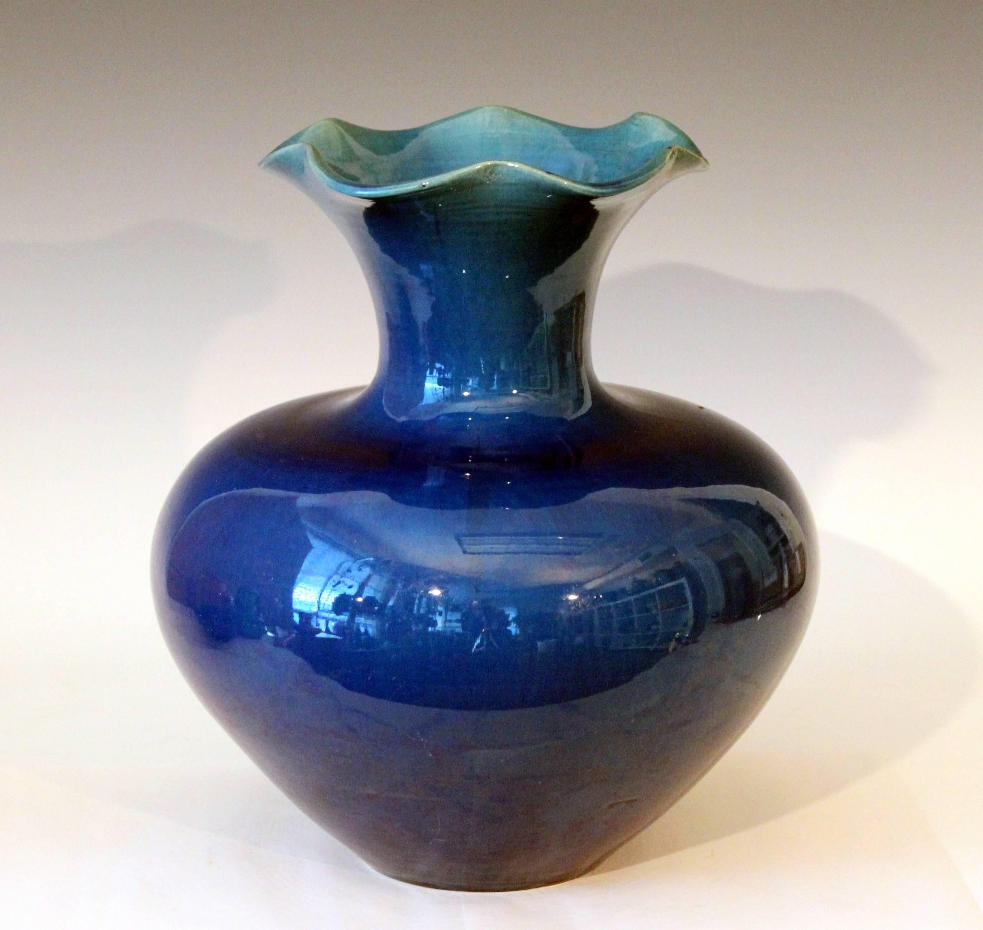 Large Awaji pottery vase in organic Art Nouveau form with flaring, ruffled mouthrim and blue monochrome glaze, circa 1910s. Measures: 12