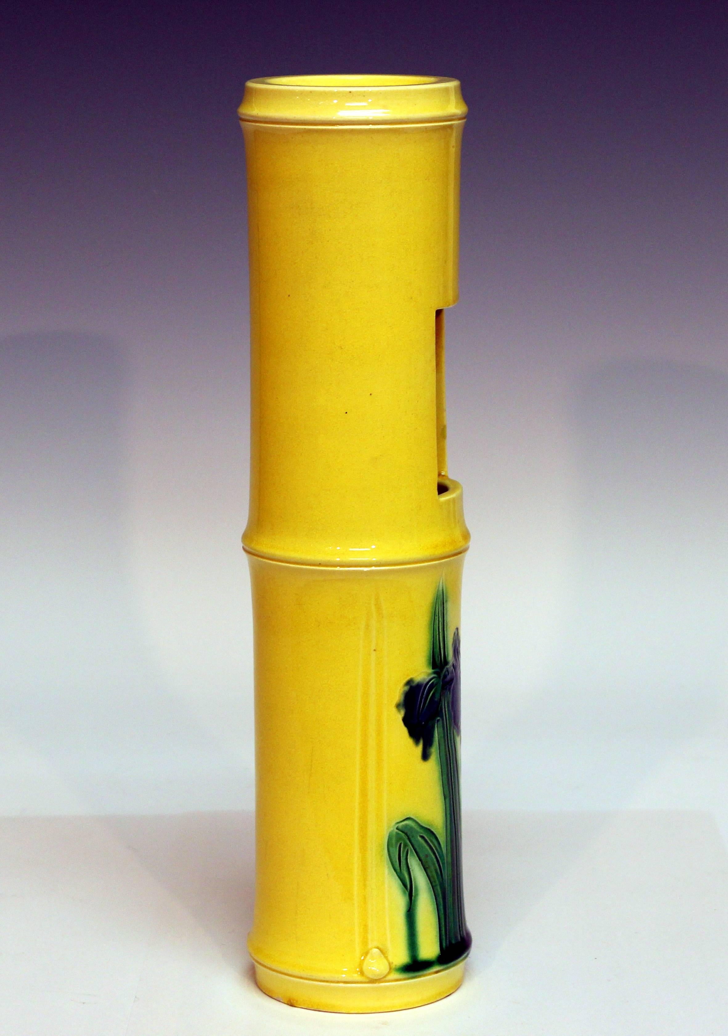 Bring nature inside, or at least to the porch or terrace, with this bright yellow Awaji wall pocket vase cleverly designed to appear as a modified bamboo section, circa 1910. Measures: 13