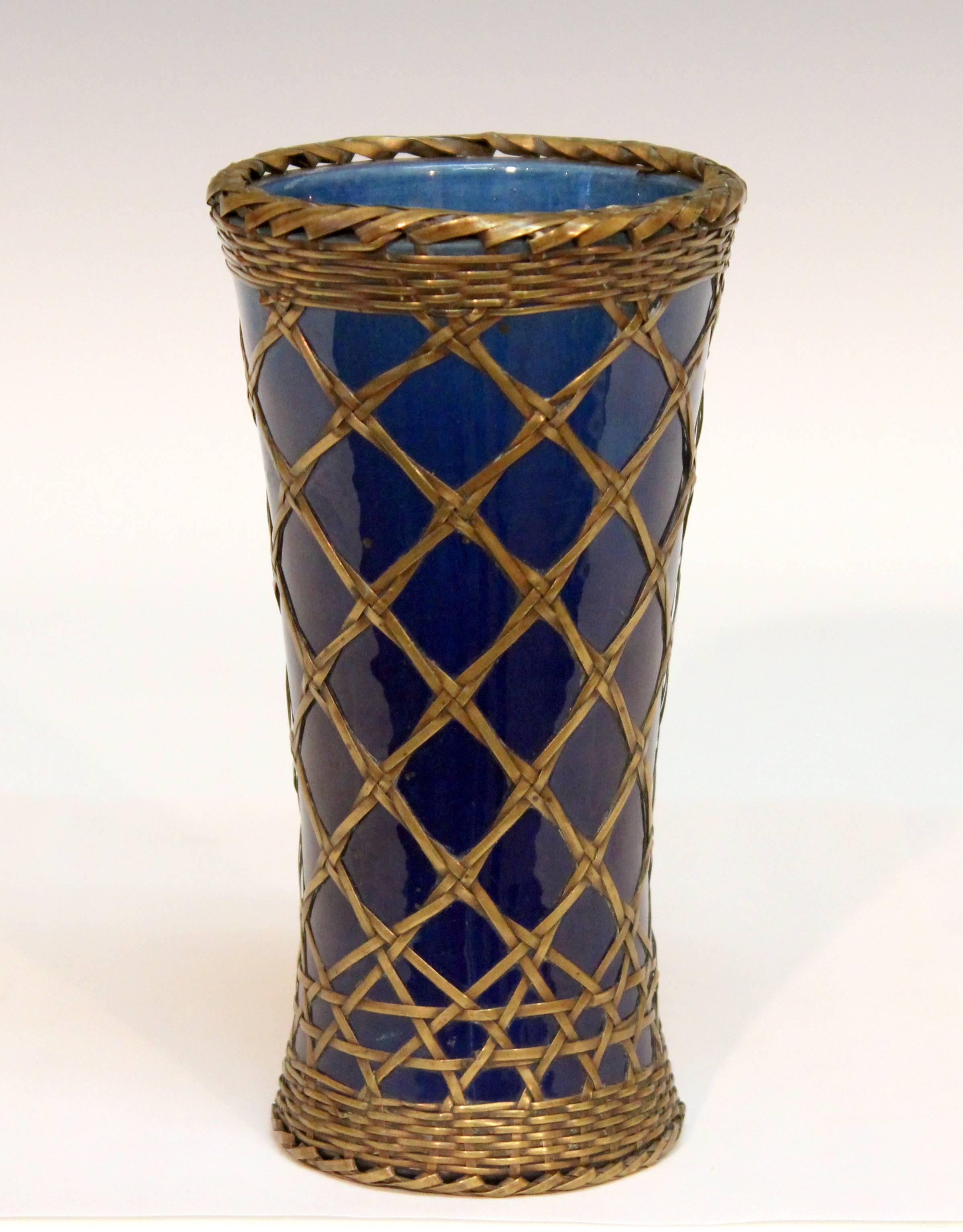 Antique Japanese Awaji vase in blue monochrome glaze with brass over-weaving, circa 1910. Impressed marks. Measures: 7
