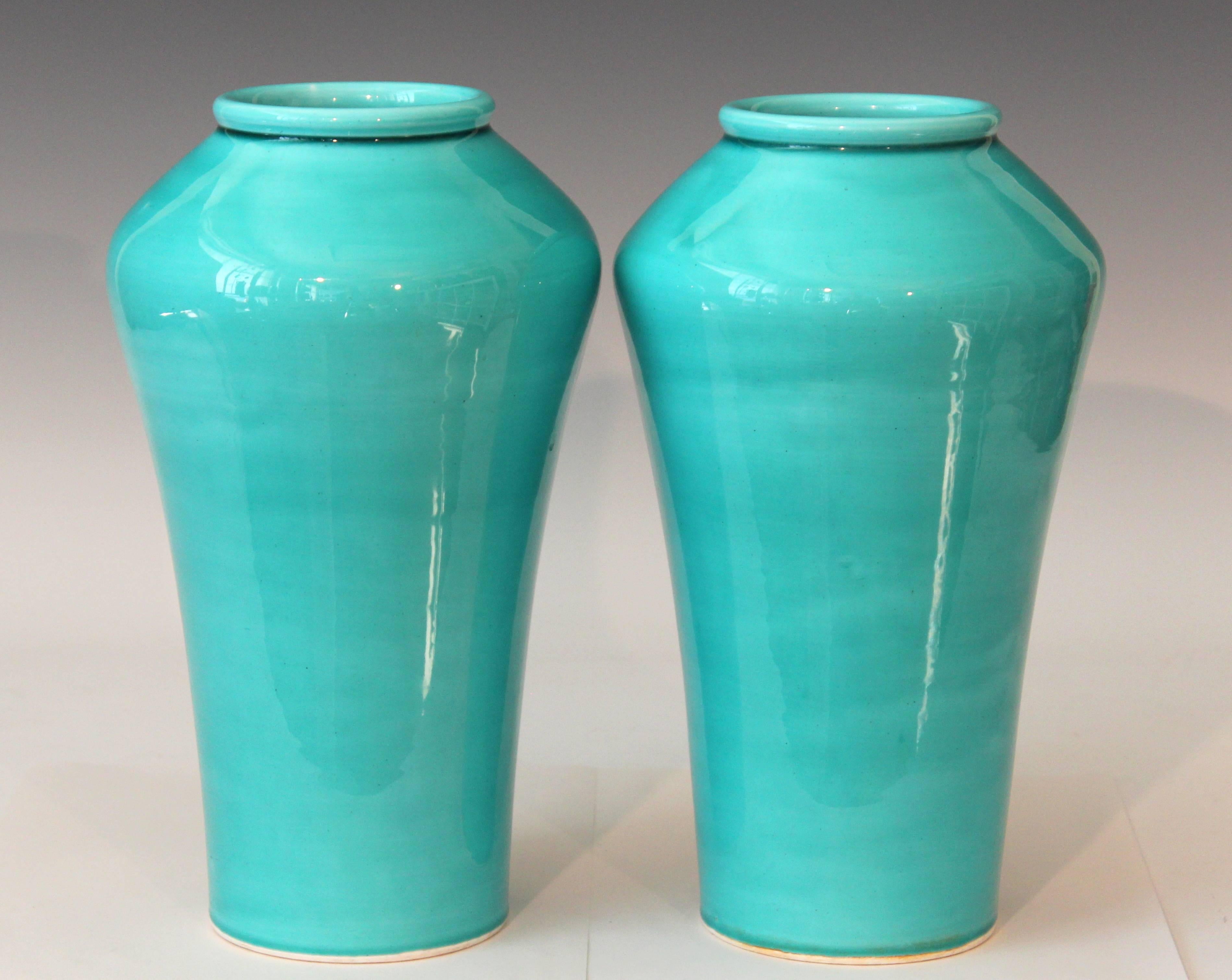 Tall pair of Awaji vases in soothing aqua glaze, circa 1910. One with impressed export mark. Measures: 11