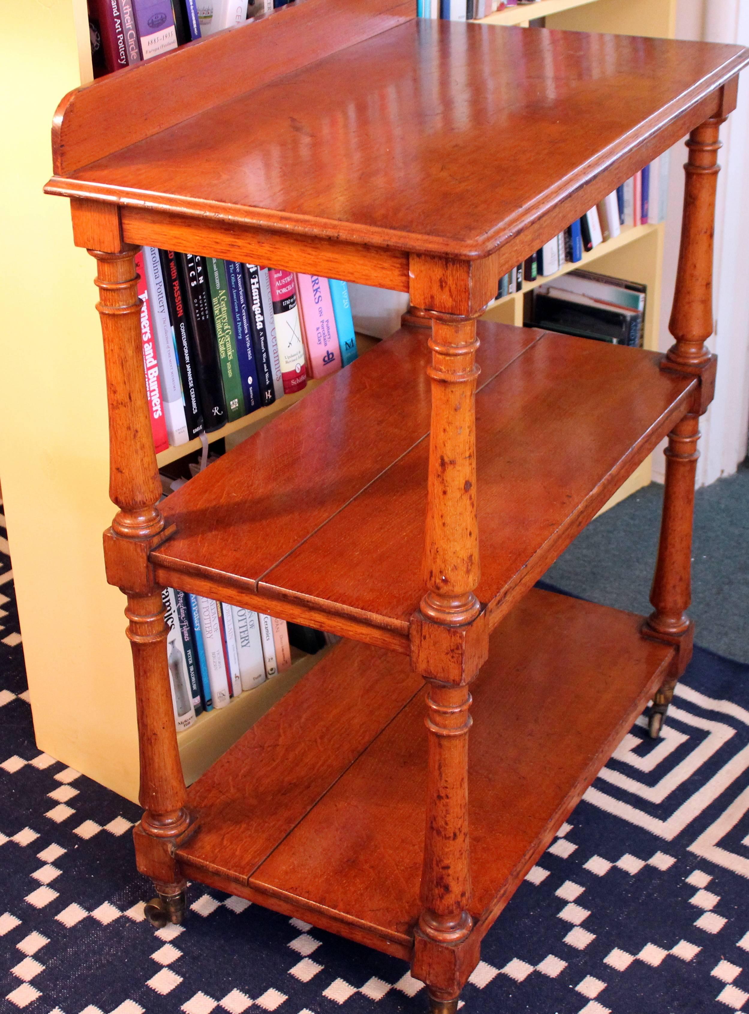 Antique English Rolling Tea Trolley Tier Table Cocktail Cart Shelves Golden Oak In Good Condition In Wilton, CT