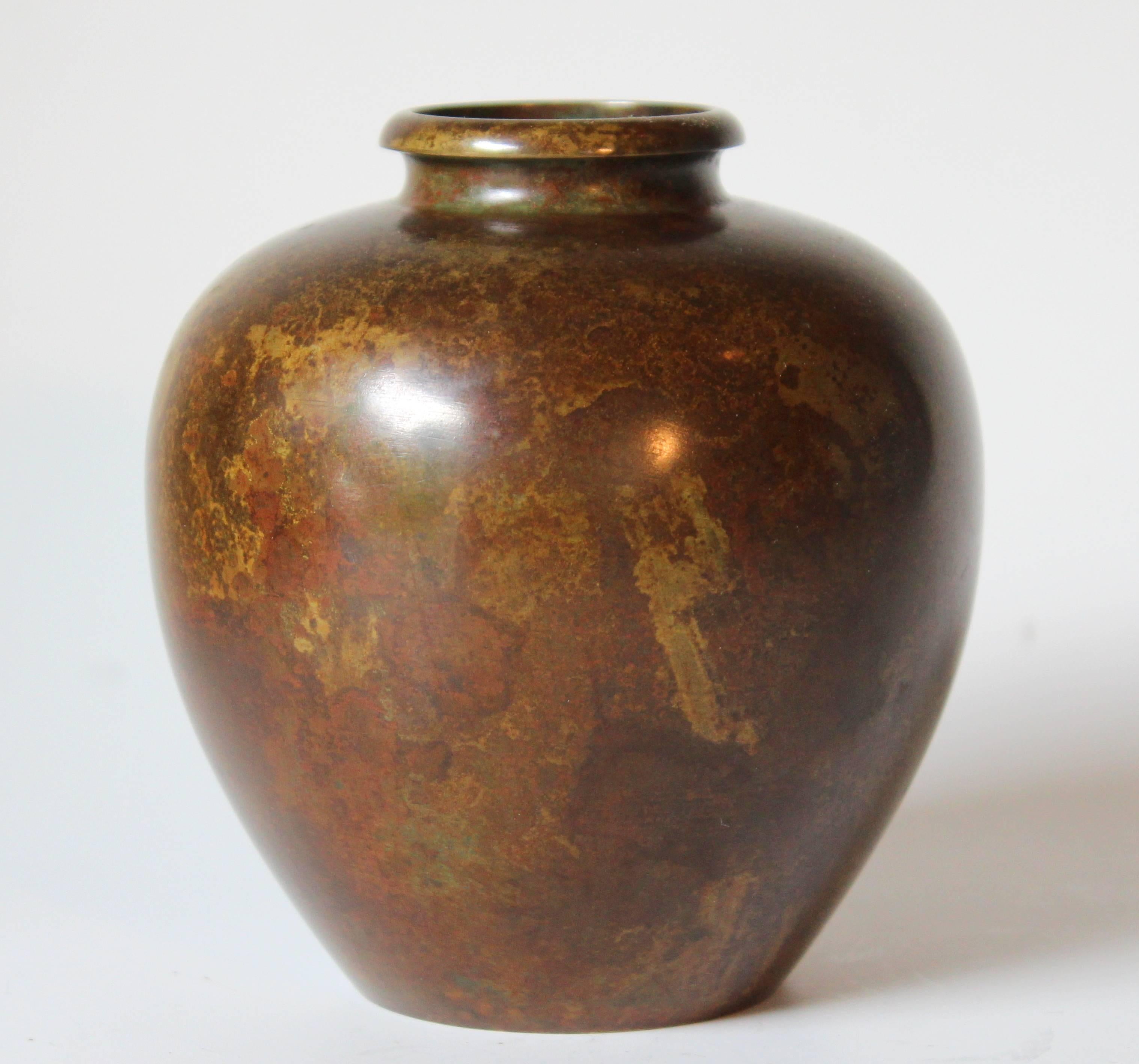 Japanese apple form bronze vase with perfectly rounded shoulder and beautiful, warm, variegated patina, circa mid-20th century. Measures: 4 3/4" high, 4 1/2" diameter. Excellent condition.