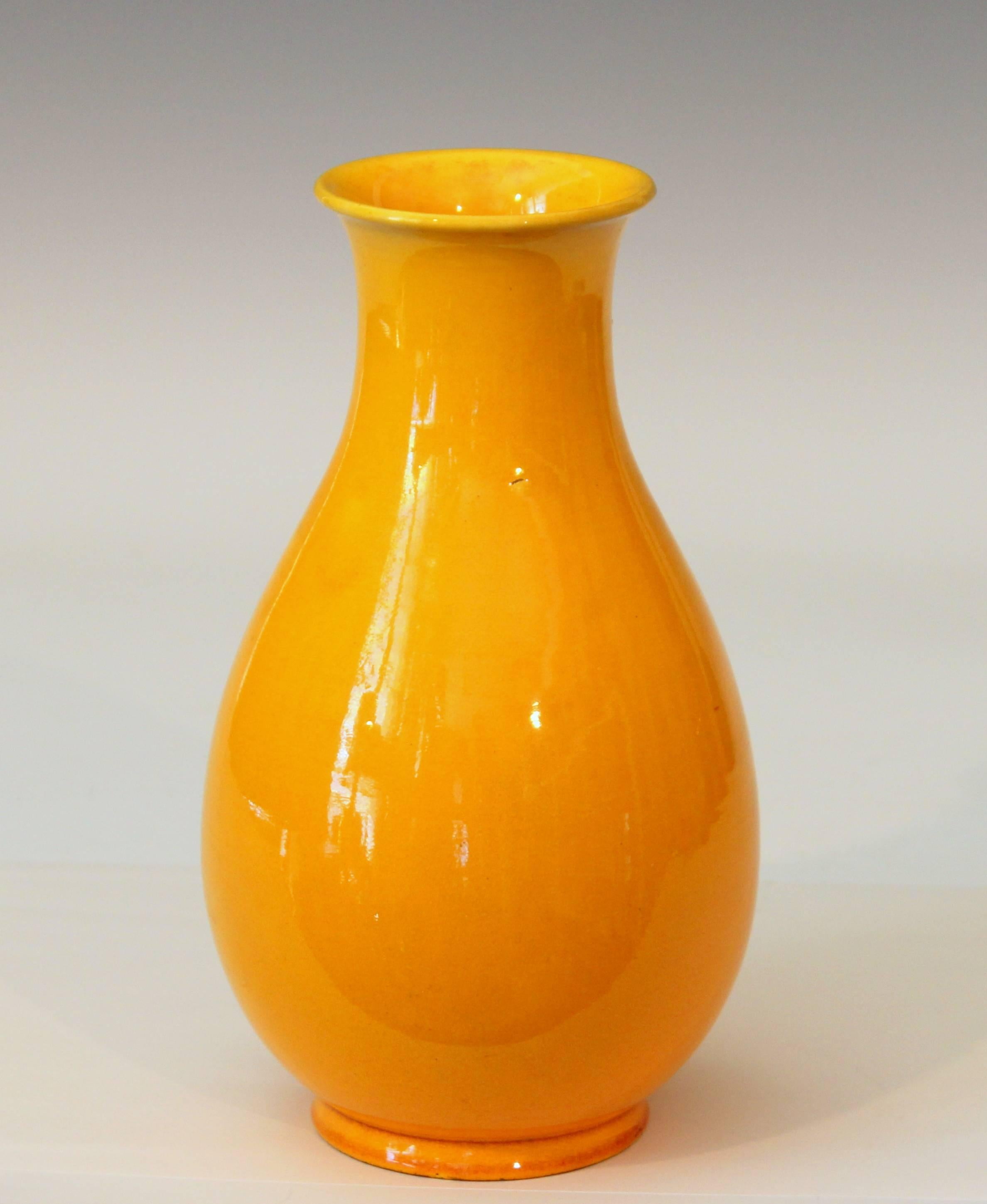 Nearly antique Awaji pottery vase in Yuhuchunping form with golden yellow monochrome glaze, circa 1930. Impressed export mark. Measure: 8 12