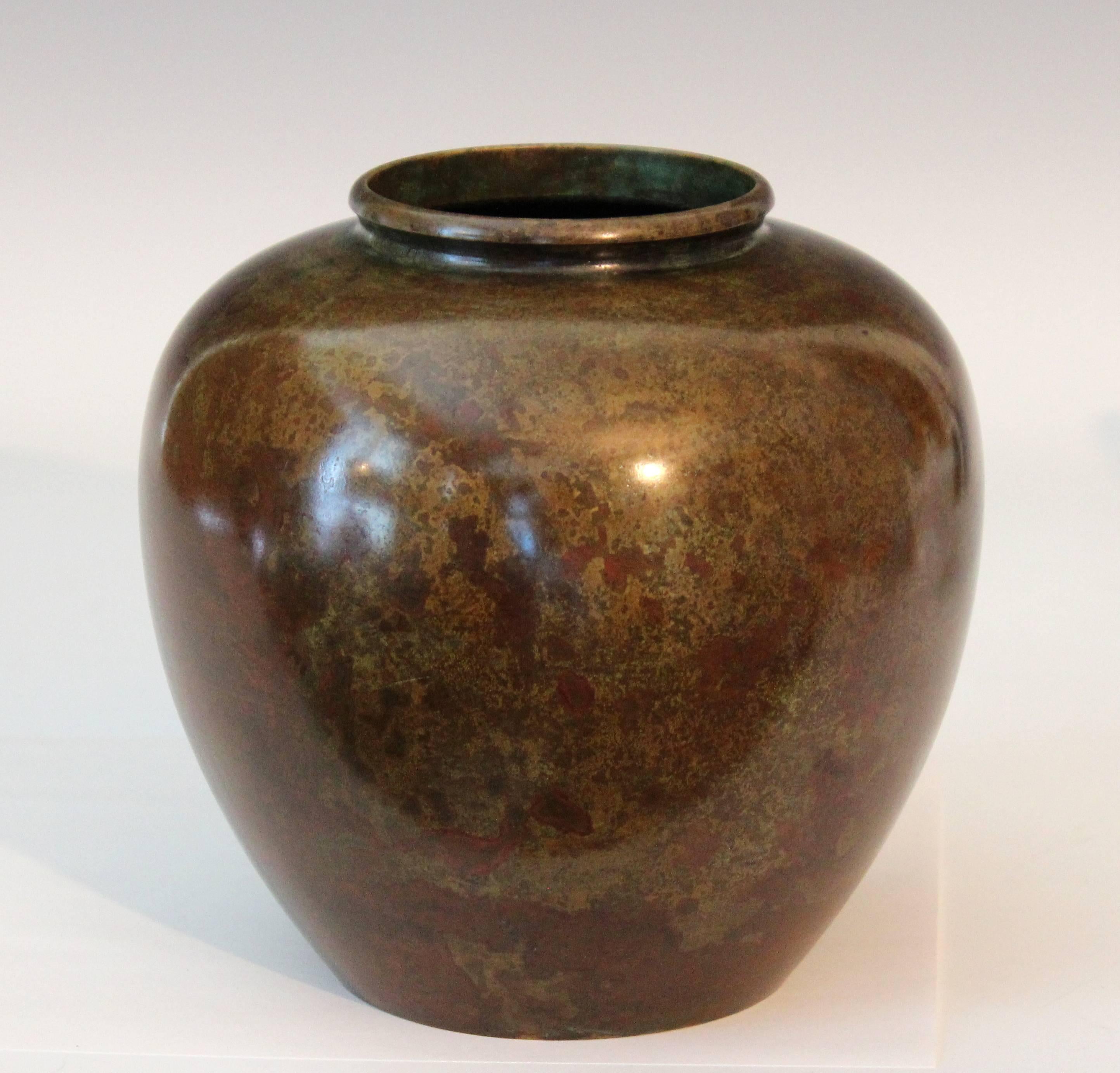 Japanese apple form bronze vase with perfectly rounded shoulder and beautiful, warm, variegated patina, circa early/mid-20th century. Measures: 7" high, 7" diameter. Excellent condition, slight ding, as shown in closeup.