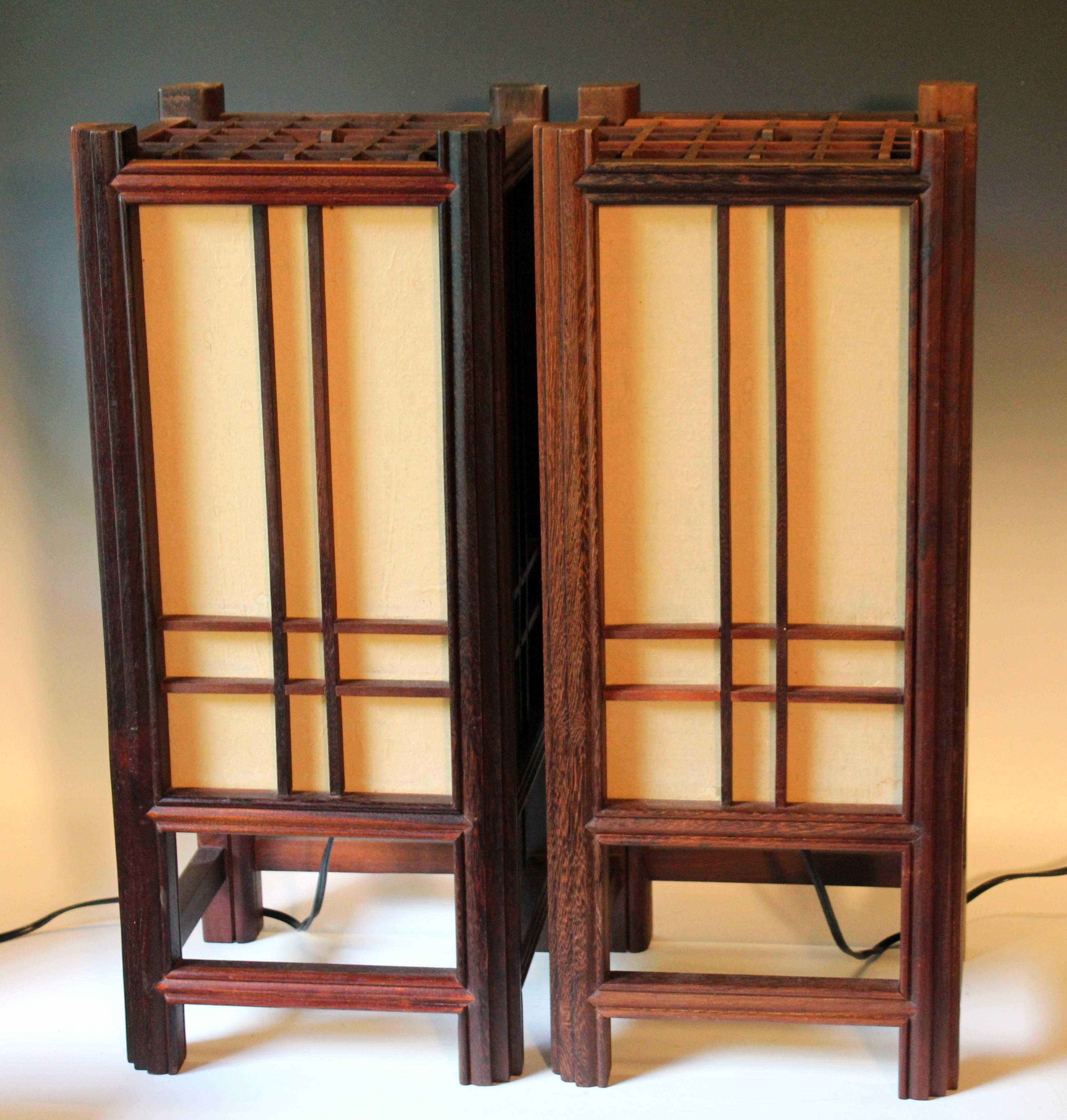 Vintage pair of large Japanese tabletop square rosewood lantern lamps, circa late 20th century. Nice quality with traditional construction, fabric covered plexi windows. Measure: 25" high, 10 5/8" square. Excellent condition, scuffing and