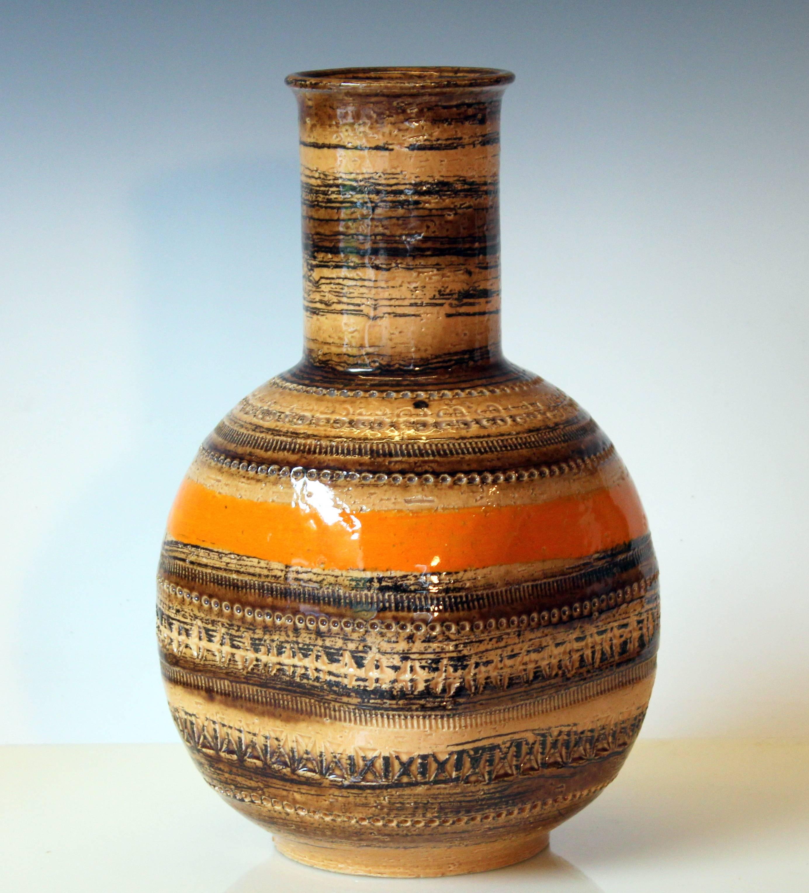 Large Bitossi vase in Sahara glazes with impressed Rimini decoration, circa 1960s. Original Raymor label. Measures: 13" high, 7" square. Excellent condition.