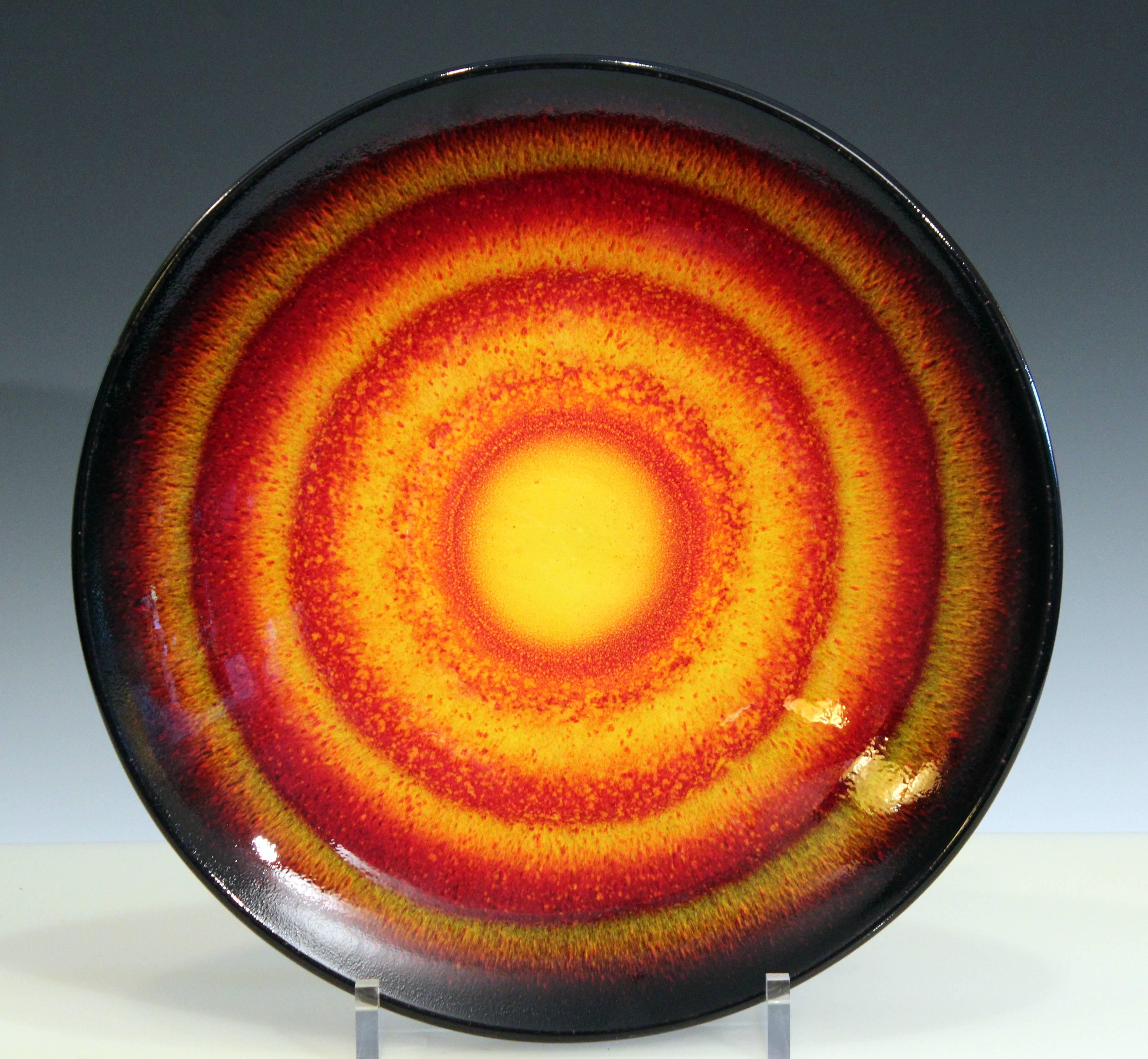 Spectacular and large Poole pottery sun charger from the sun and moon collection in limited edition of 1000. Measure: 42 cm. diameter. Perfect condition.