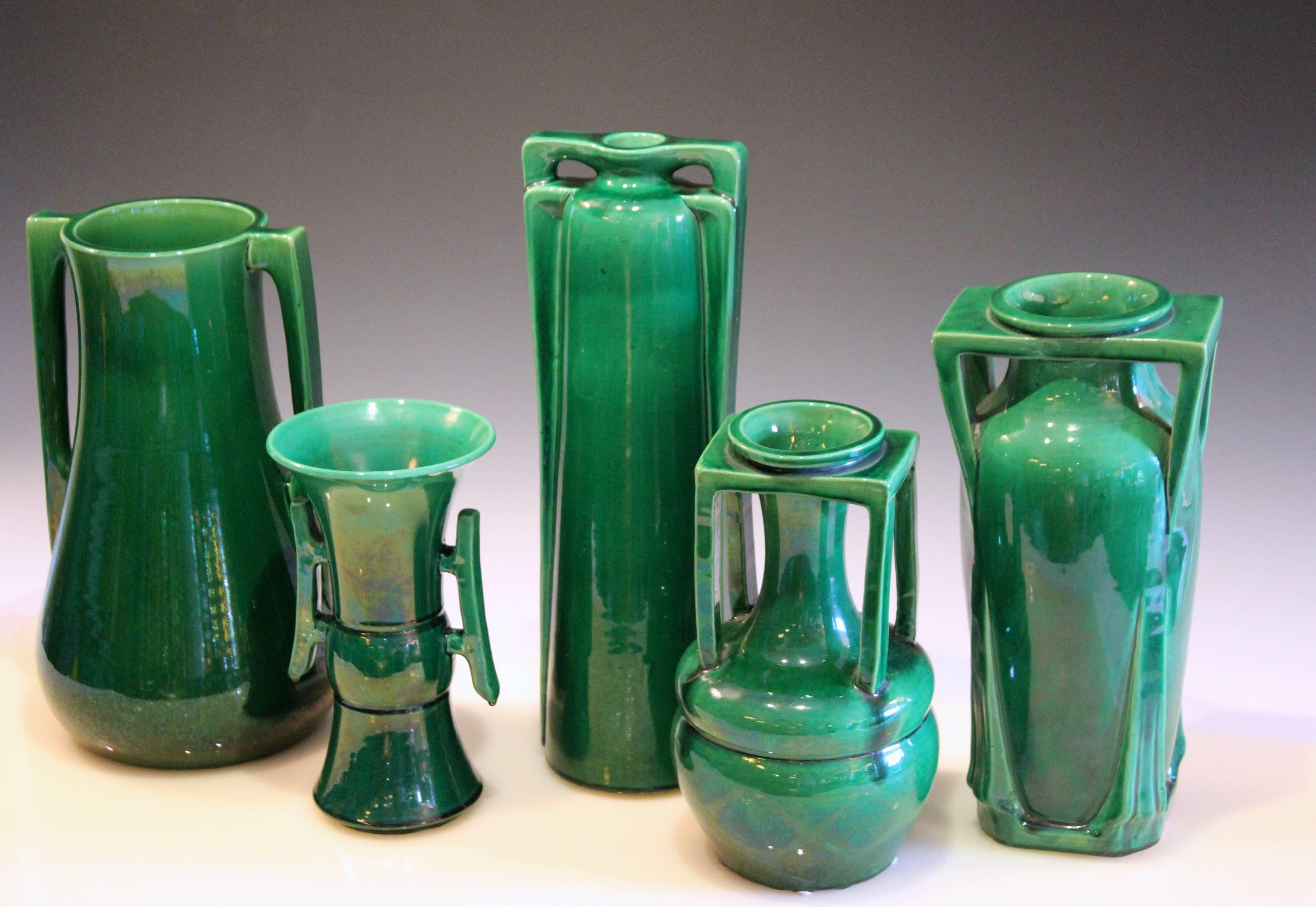 Collection of five Awaji Pottery period Art Deco vases in great architectural forms with sleek green monochrome glaze, circa 1920. 8 3/4