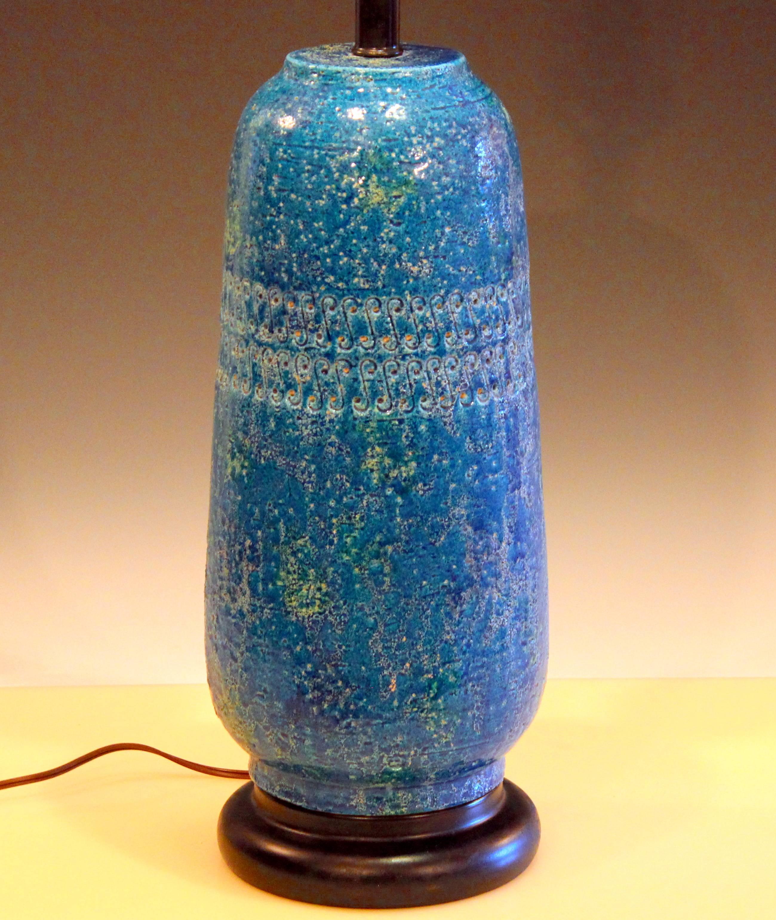 Great Bitossi pottery lamp in Rimini blue Chinese glaze with impressed design around shoulder. The textured and variegated glaze gives the appearance of a deeply saturated color. Measures: 29