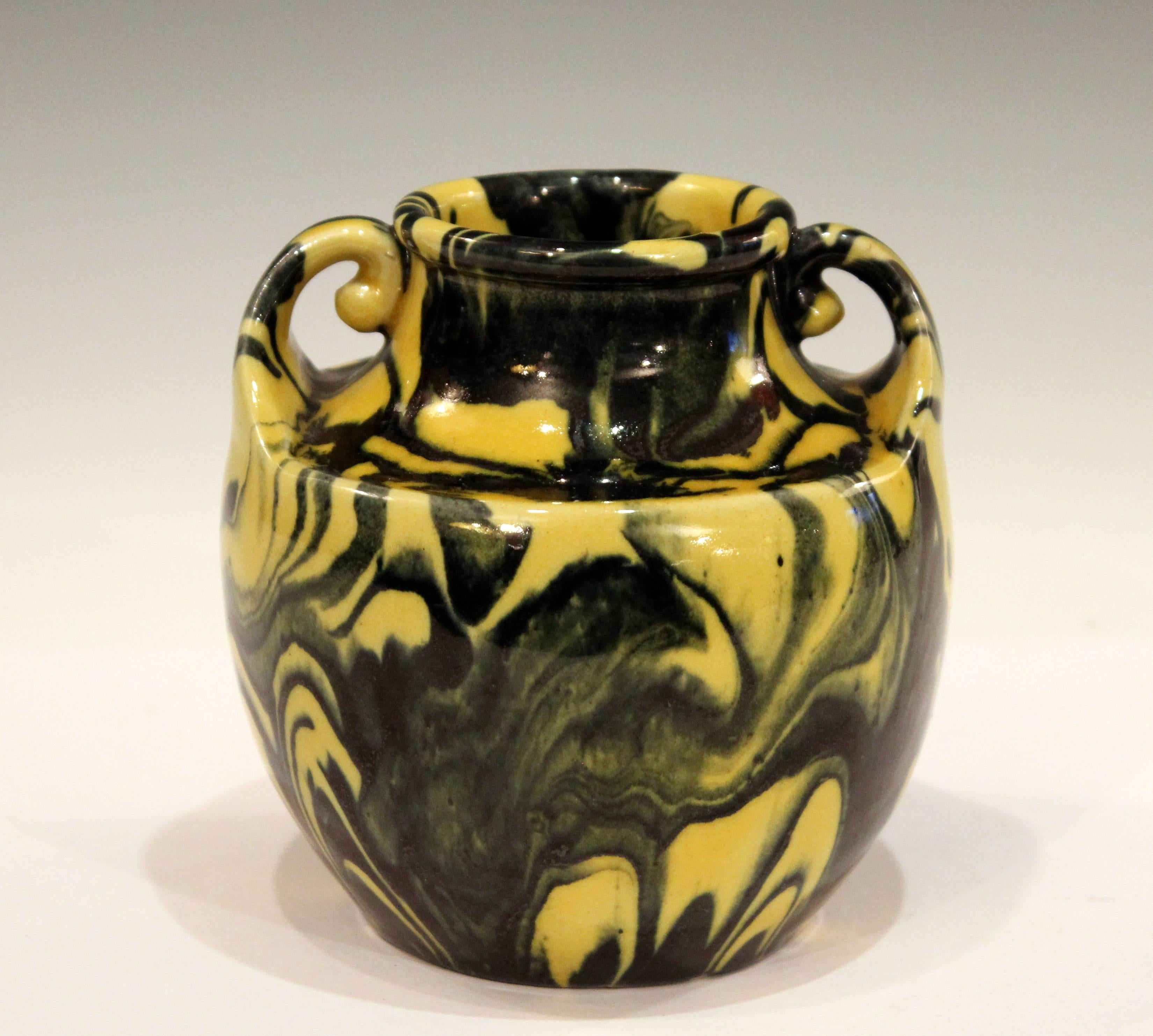Awaji pottery vase in Art Deco form with little curled handles reaching up from the flattened shoulder, circa 1930. With striking combination of yellow and black metallic glazes marbled to great effect with strong contrasts. 5