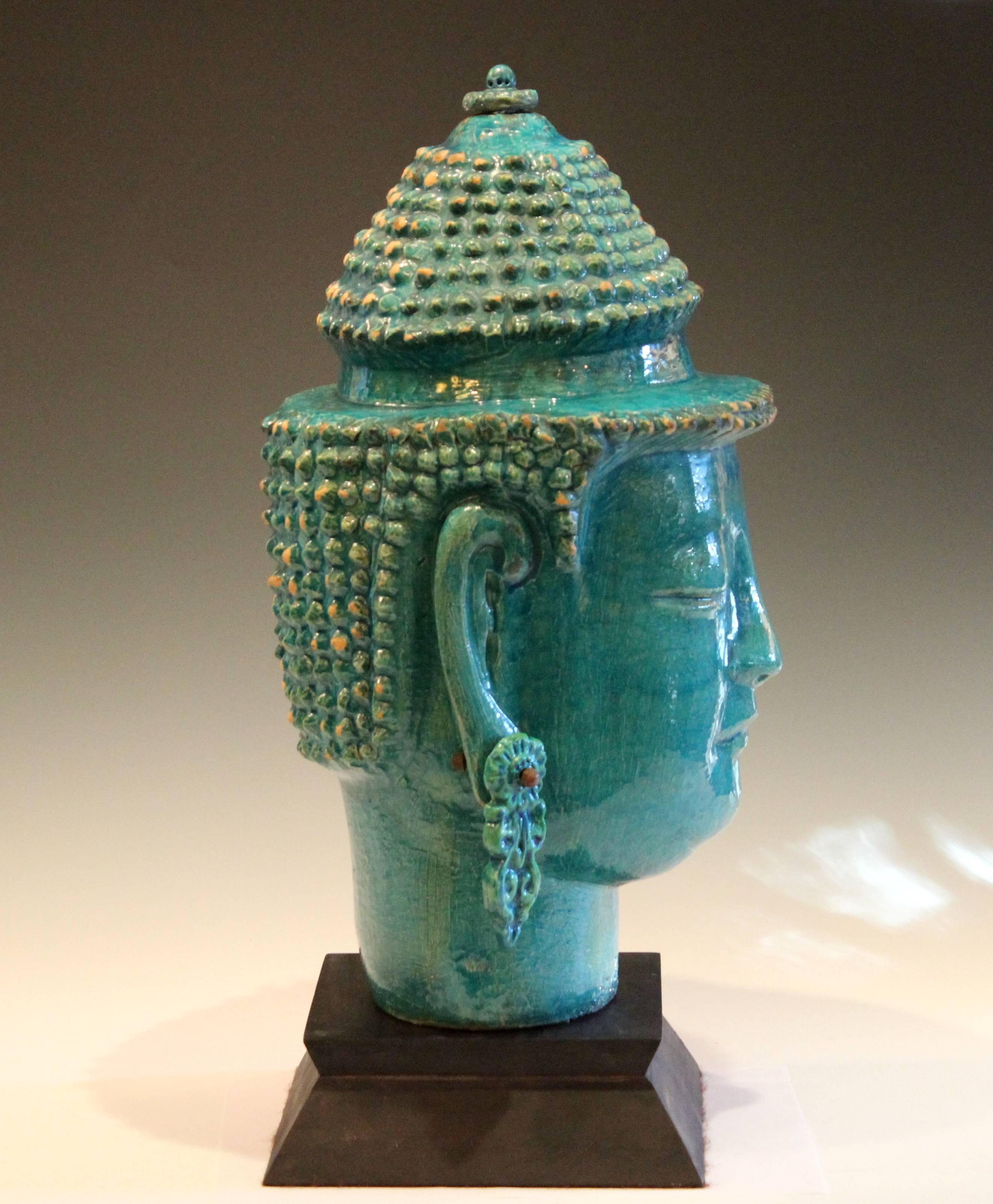 Huge vintage Italian pottery Buddha head on stand, circa 1960s, attributed to the Zaccagnini pottery of Florence. With large dangling earrings and turquoise and green crackle glaze. Measure: 20 1/4" high, approximate 9 1/2" diameter.
