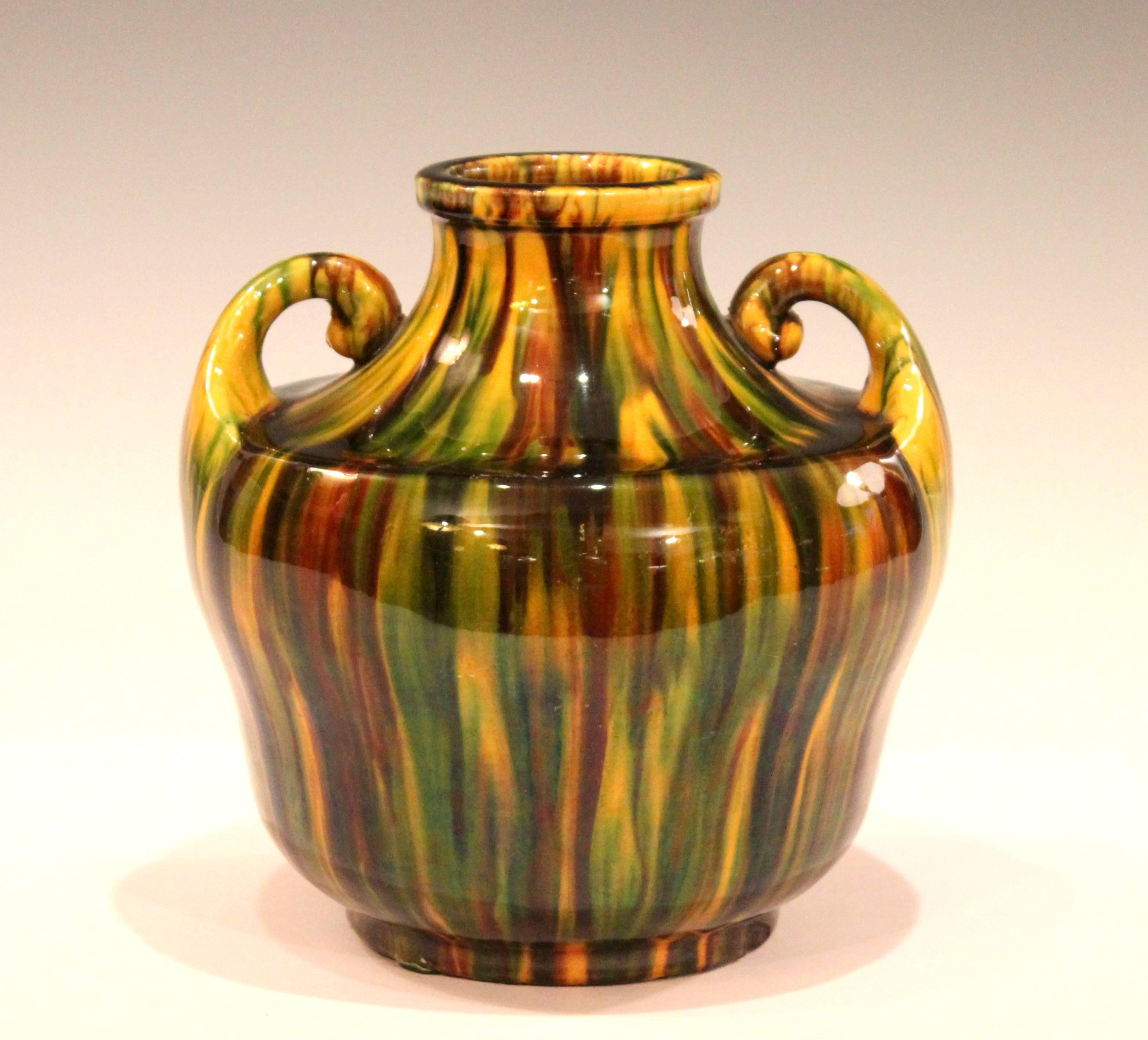 Awaji Pottery vase in Art Deco form with little handles curled over the wide, recessed shoulder and striking yellow flambe glaze, circa 1930. Impressed marks. Measure: 6 1/8