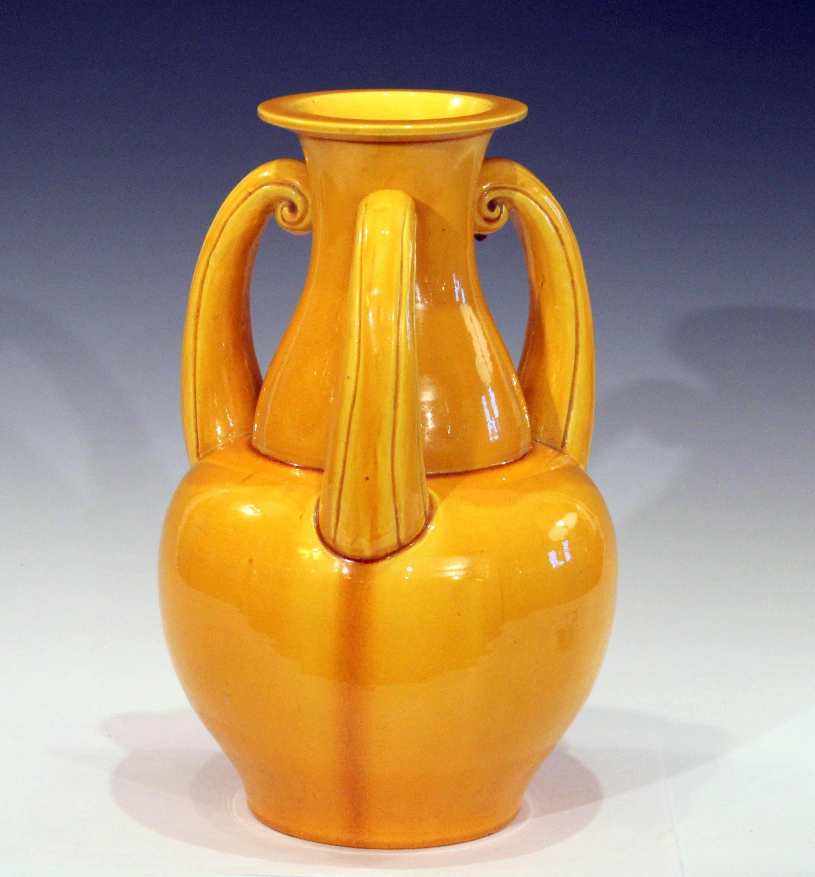 Large Awaji vase in organic gourd form with three curling handles and bright yellow glaze with fine pattern of crackle, circa 1920's. 12