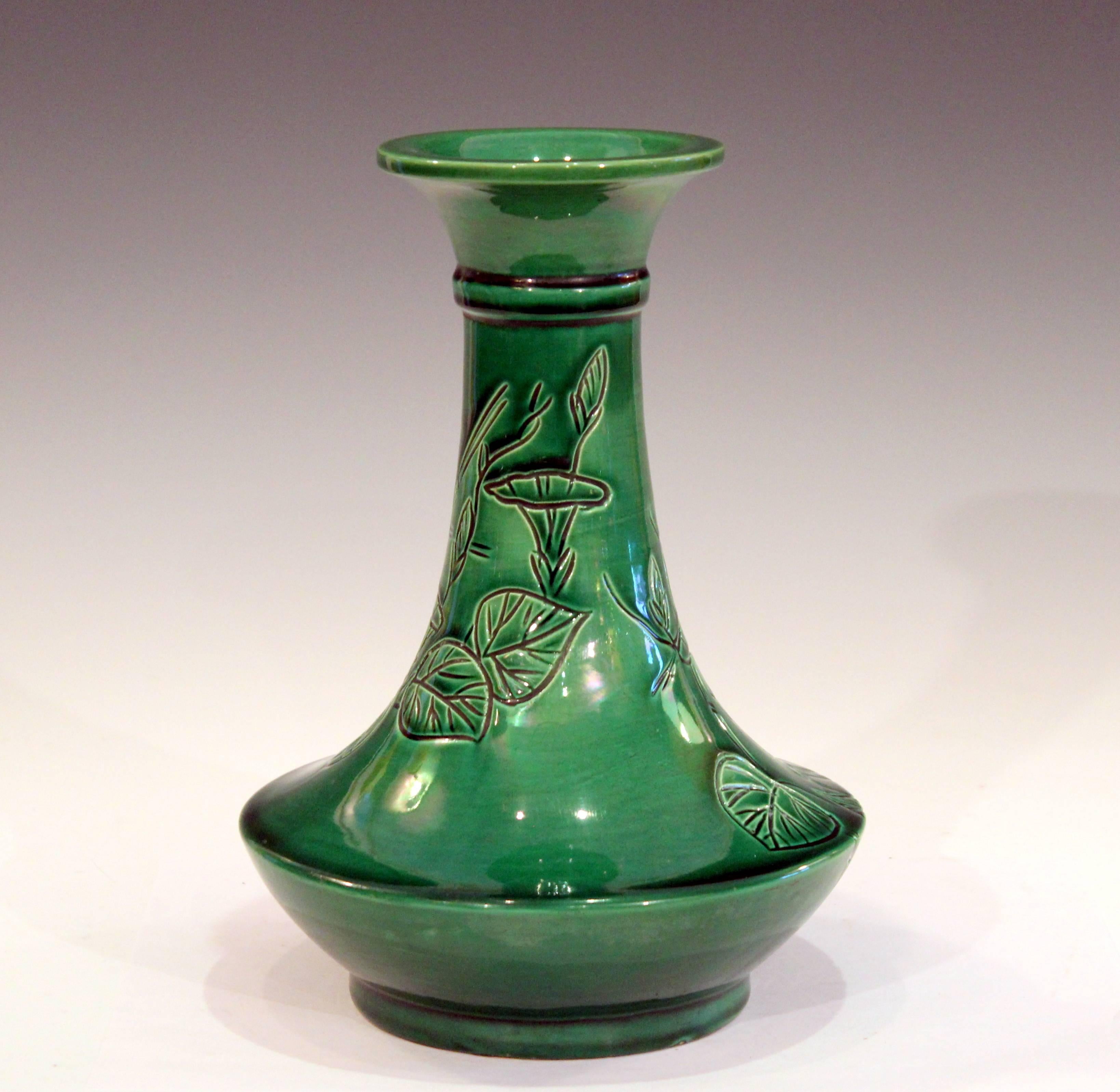 Antique Awaji bottle vase in deep green monochrome glaze with incised spray of well drawn bell flowers, circa 1910s. Measures: 10 1/2