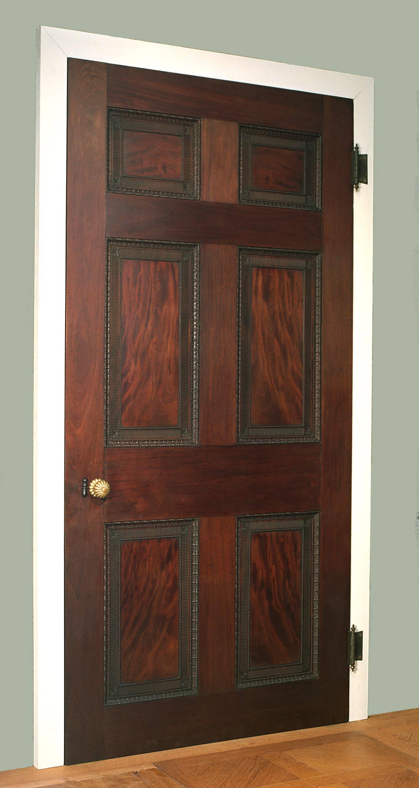 A very fine and important Adam period flame grain mahogany door, having six carved panels each with exquisite acanthus carving, beading and reeding. English, circa 1770.

Height: 93 1/2