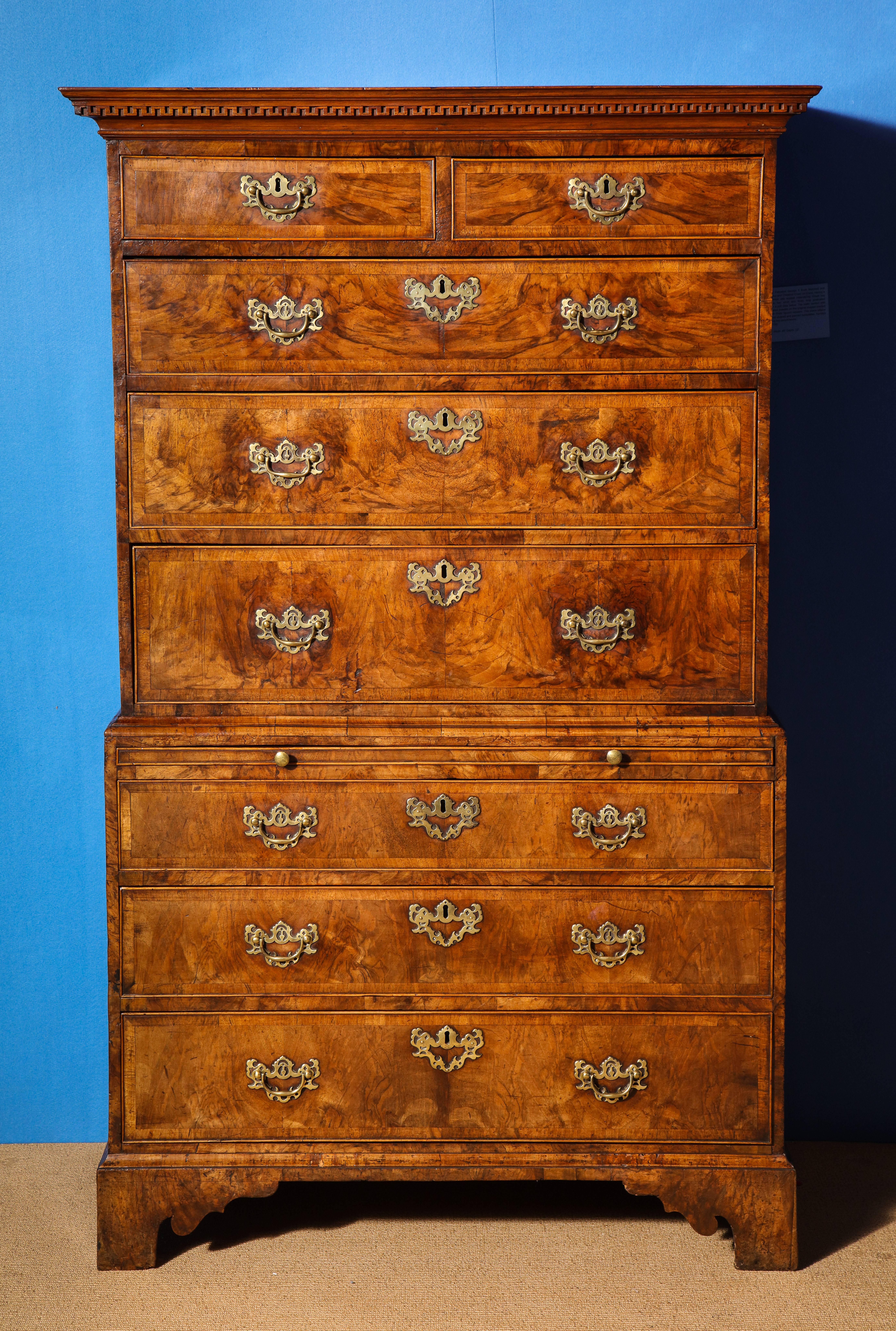 A Beautifully Patinated and Proportioned George II Book-Matched Burl and Figured Walnut and Chest on Chest. The moulded cornice above a band of carved meandering Greek key with two short and three long drawers below, The lower section with a