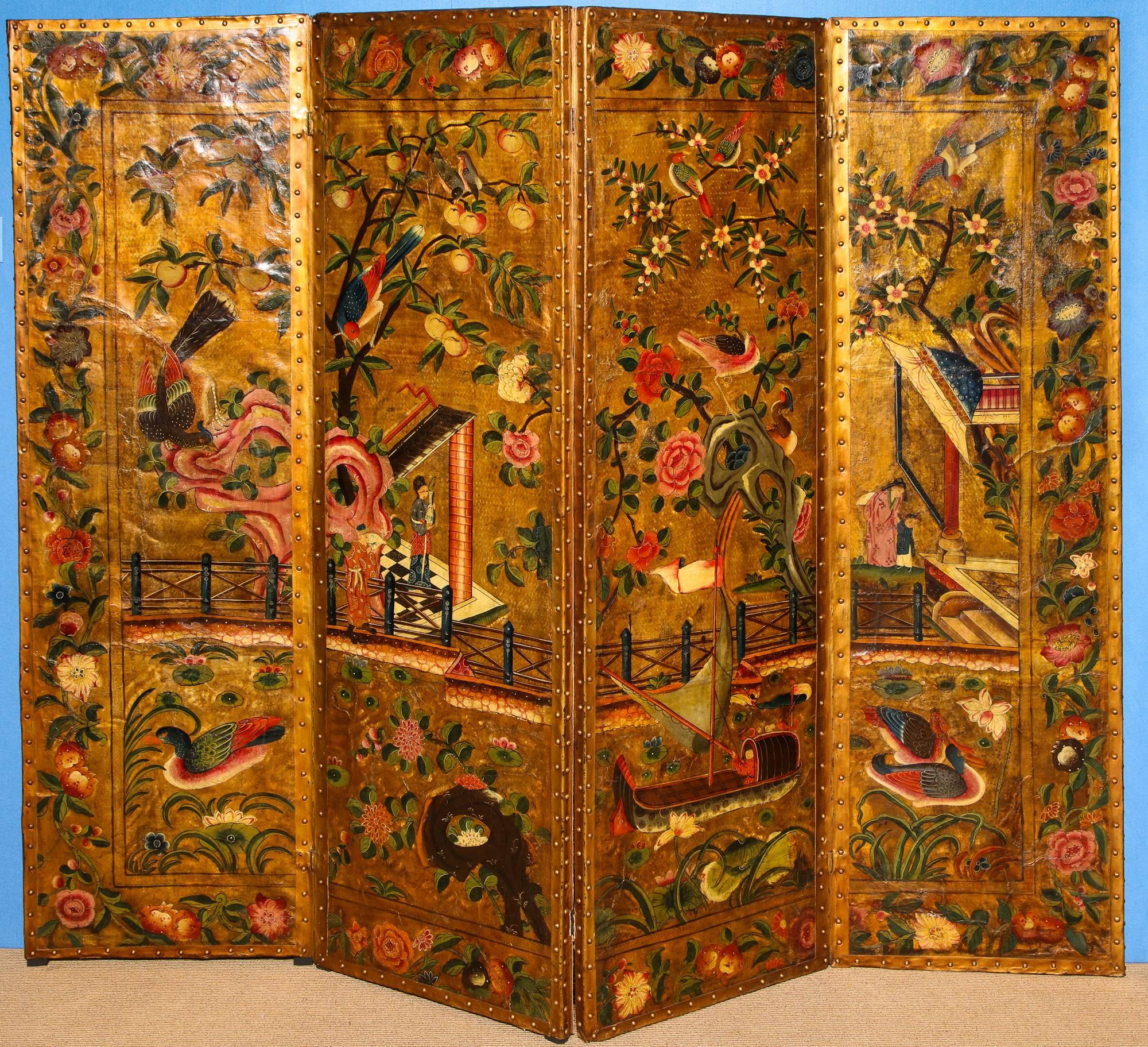 Mid-18th century chinoiserie polychrome painted four-panel gilt leather screen, decorated with figures and pavilions with a boat and flora and fauna in a watery landscape, all on a gilt ground within a colorful floral rectangular border,
English,