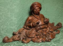 Carved and Patinated Oak Tobacco Shop Figure of a Seated Turk, Dutch, circa 1850