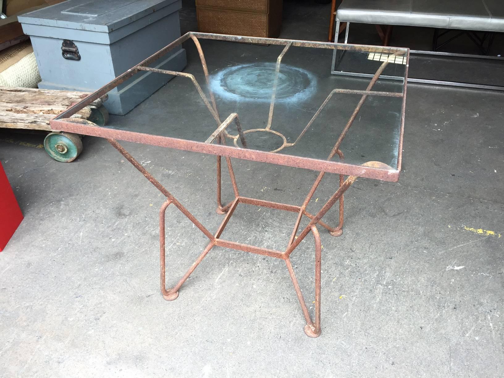 Iron and glass Mid-Century garden table.
Measures: 32.63 W x 32.63 D x 29.38 H.
23.50 clearance table top to floor.