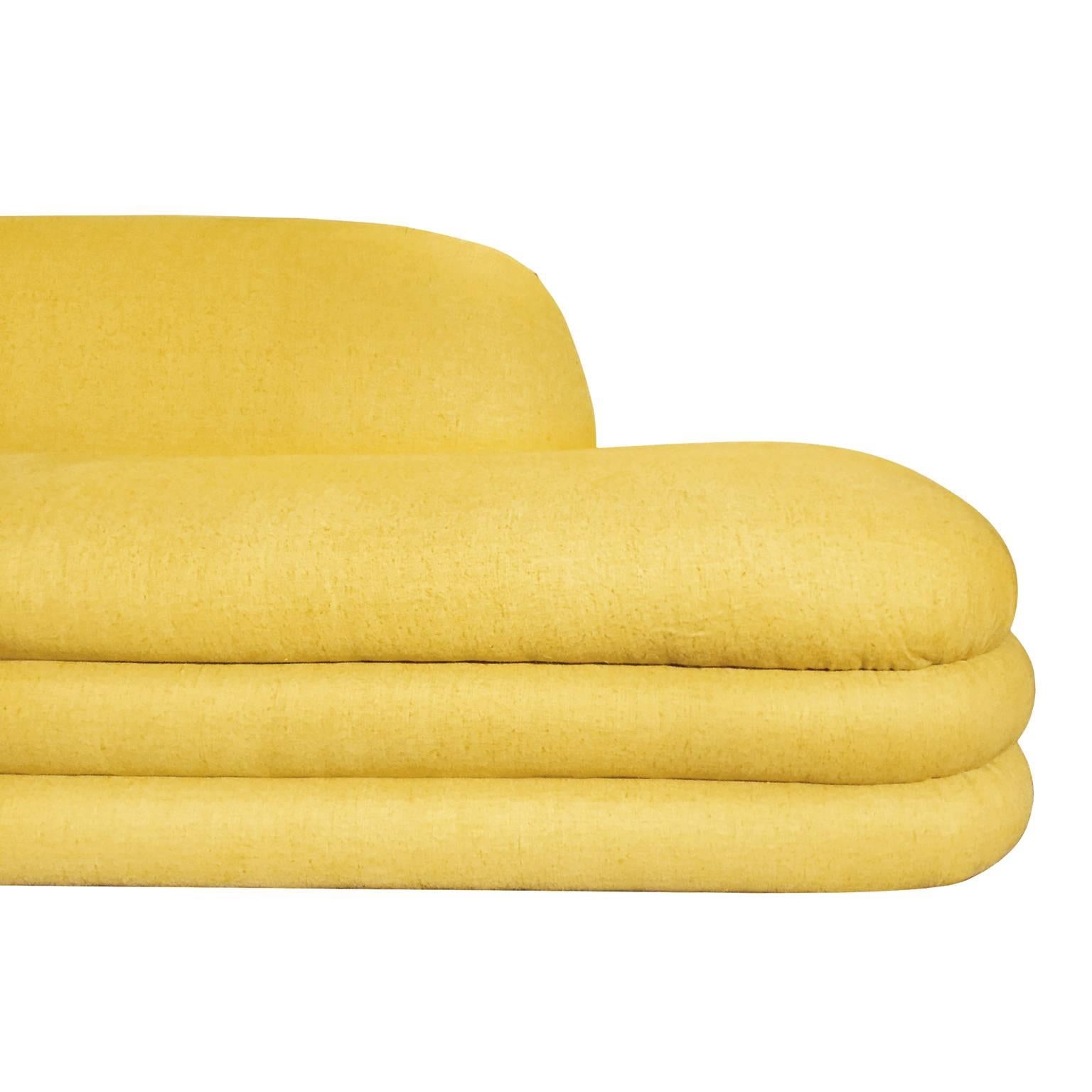 Large curved two-piece sectional sofa with original yellow upholstery. USA, 1970s. 